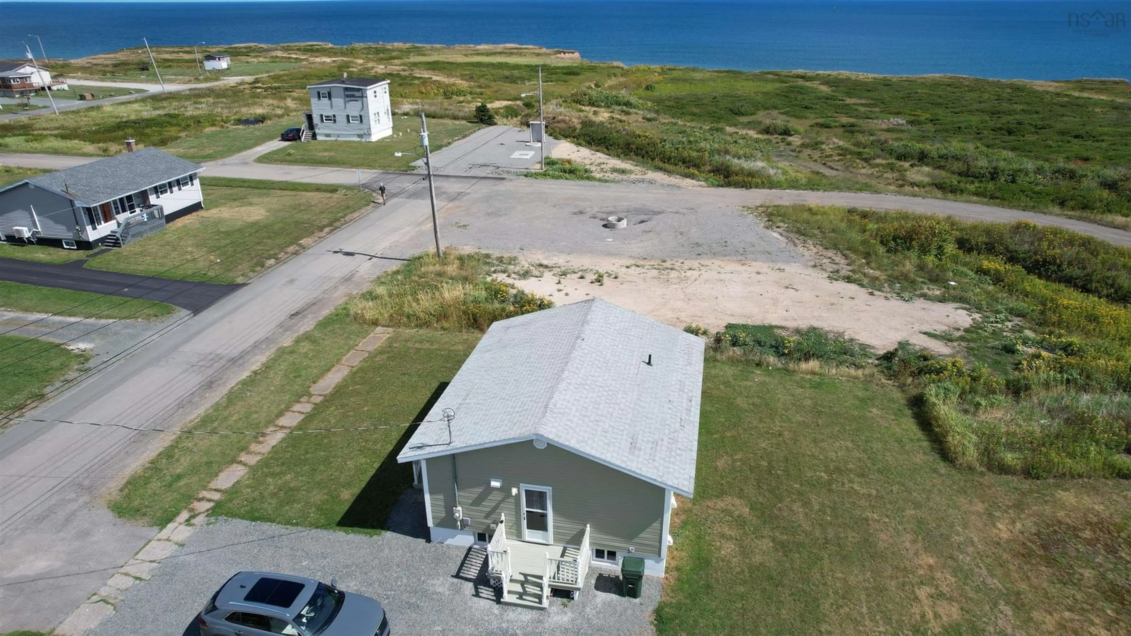 A pic from outside/outdoor area/front of a property/back of a property/a pic from drone, water/lake/river/ocean view for 96 Second Street, Glace Bay Nova Scotia B1A 4E4