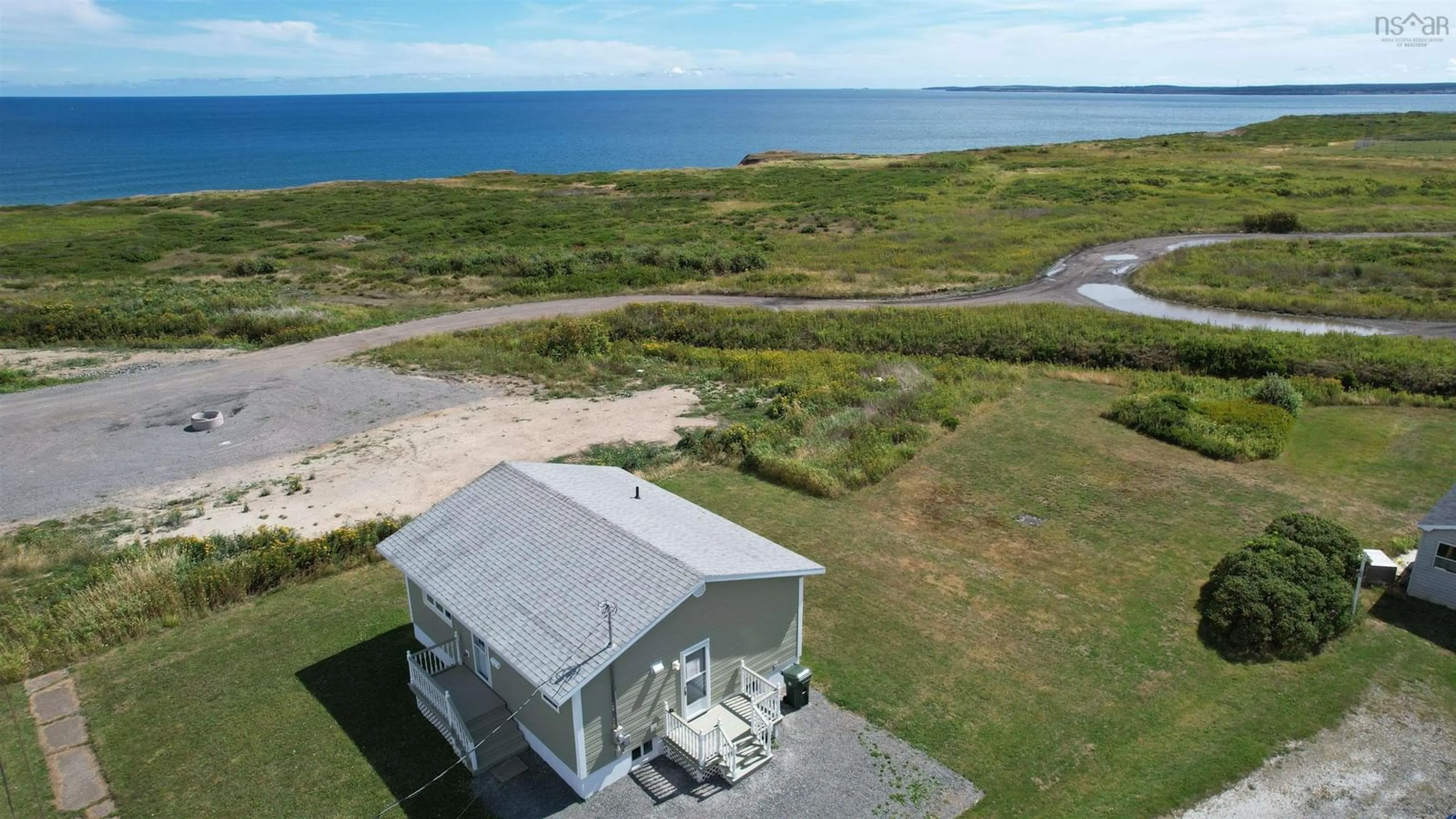 A pic from outside/outdoor area/front of a property/back of a property/a pic from drone, water/lake/river/ocean view for 96 Second Street, Glace Bay Nova Scotia B1A 4E4