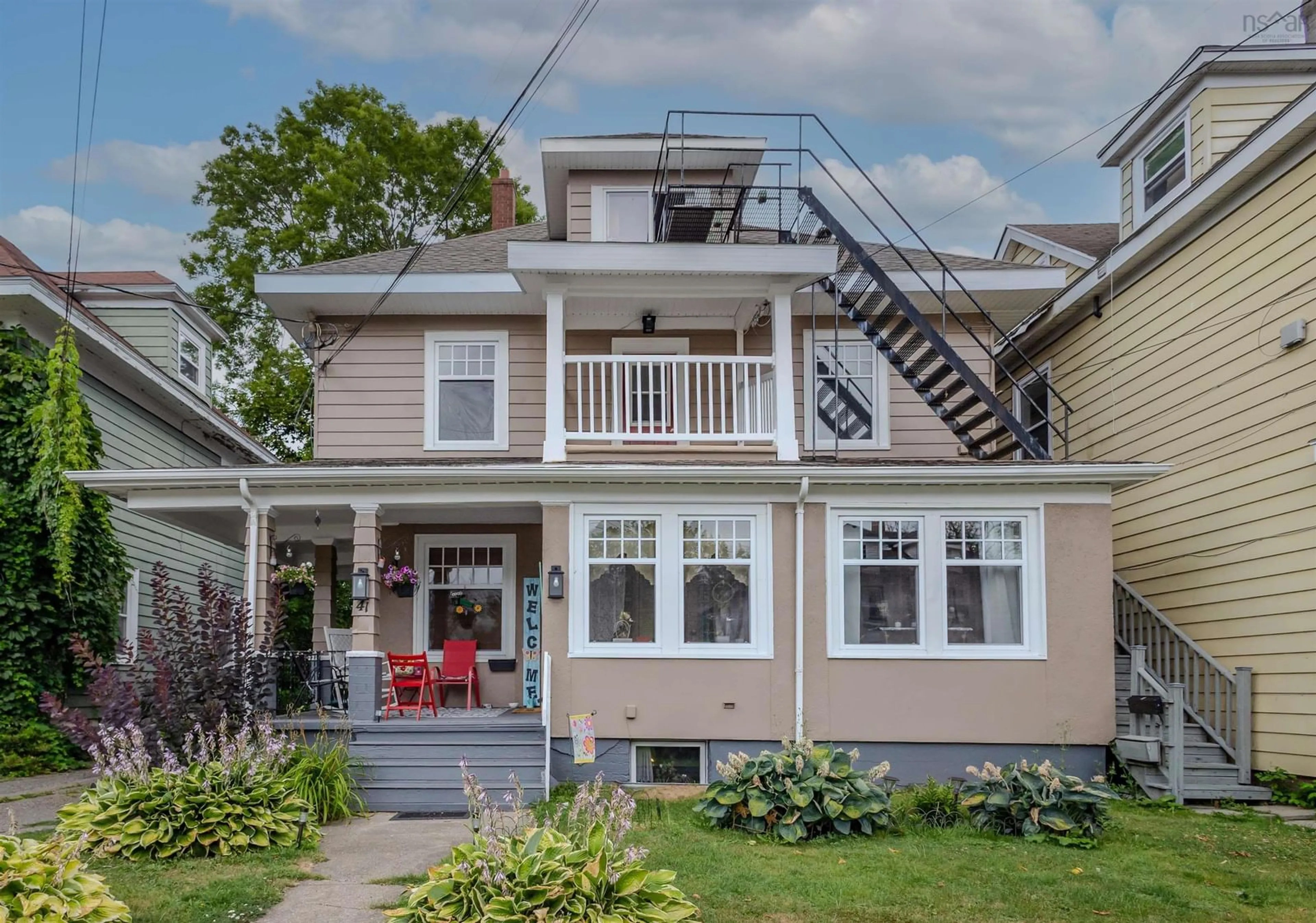 Home with vinyl exterior material, street for 41 Charlotte, Sydney Nova Scotia B1P 1B5