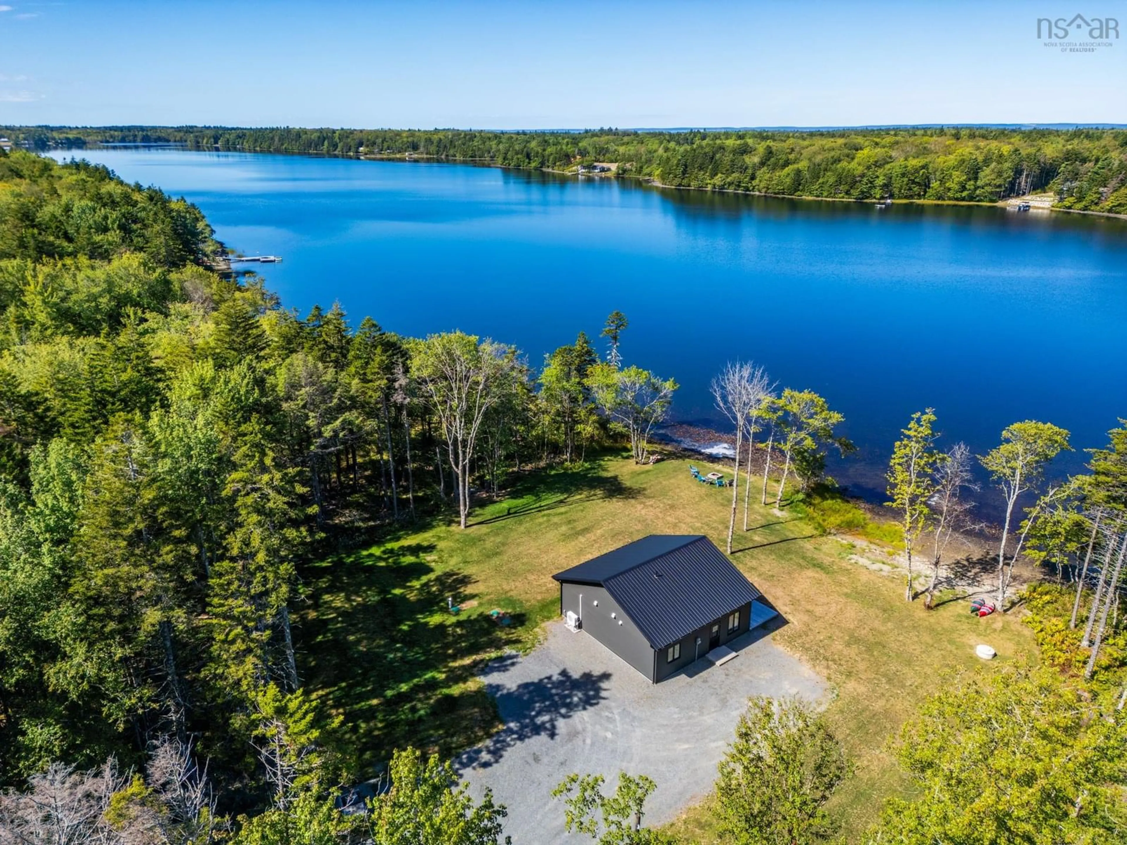 A pic from outside/outdoor area/front of a property/back of a property/a pic from drone, water/lake/river/ocean view for 43 Belliveau Lake Estates Road, Belliveaus Cove Nova Scotia B0W 1J0