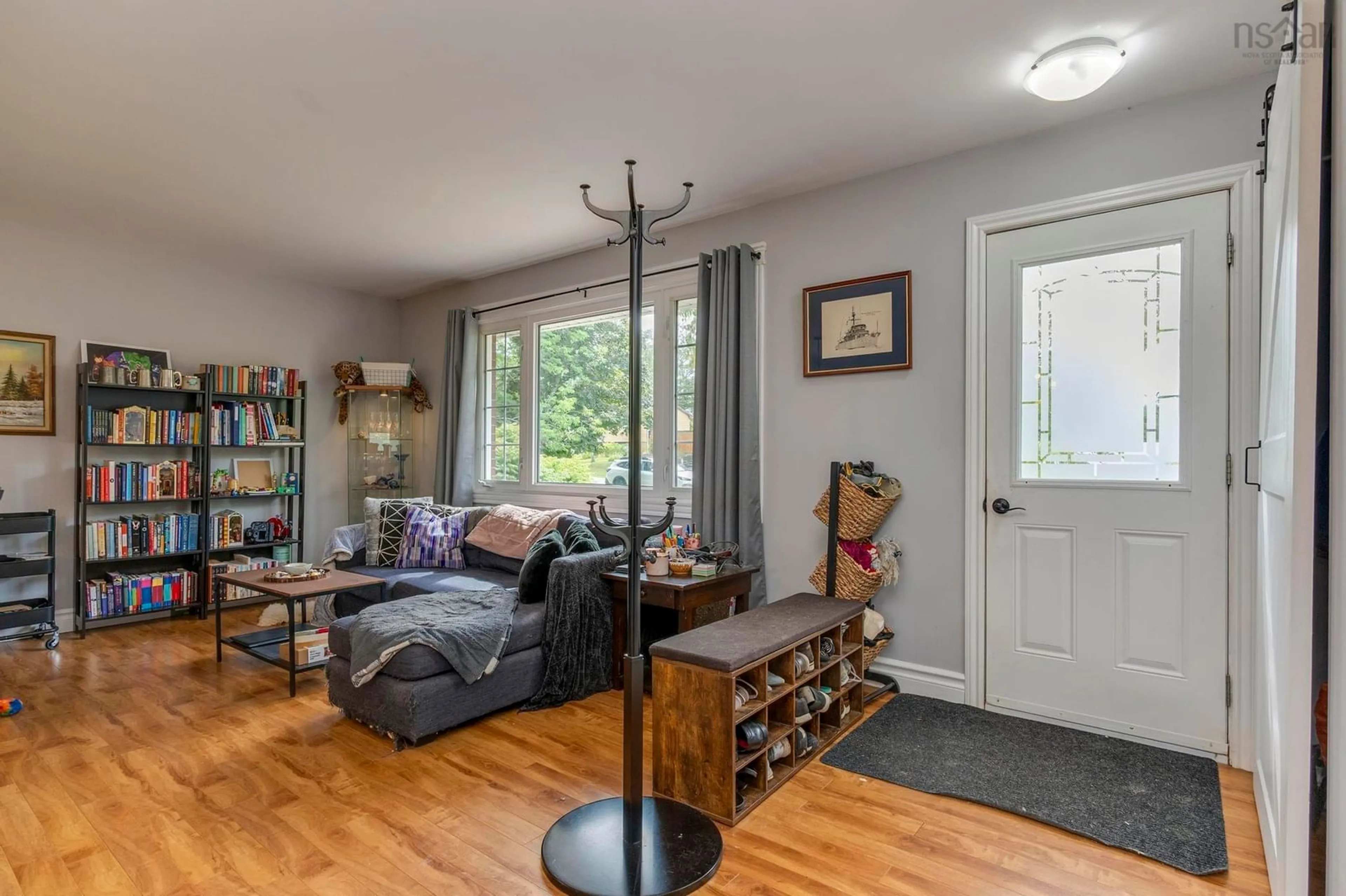 Living room with furniture, wood/laminate floor for 38 Ashgrove Dr, Colby Nova Scotia B3V 1G6