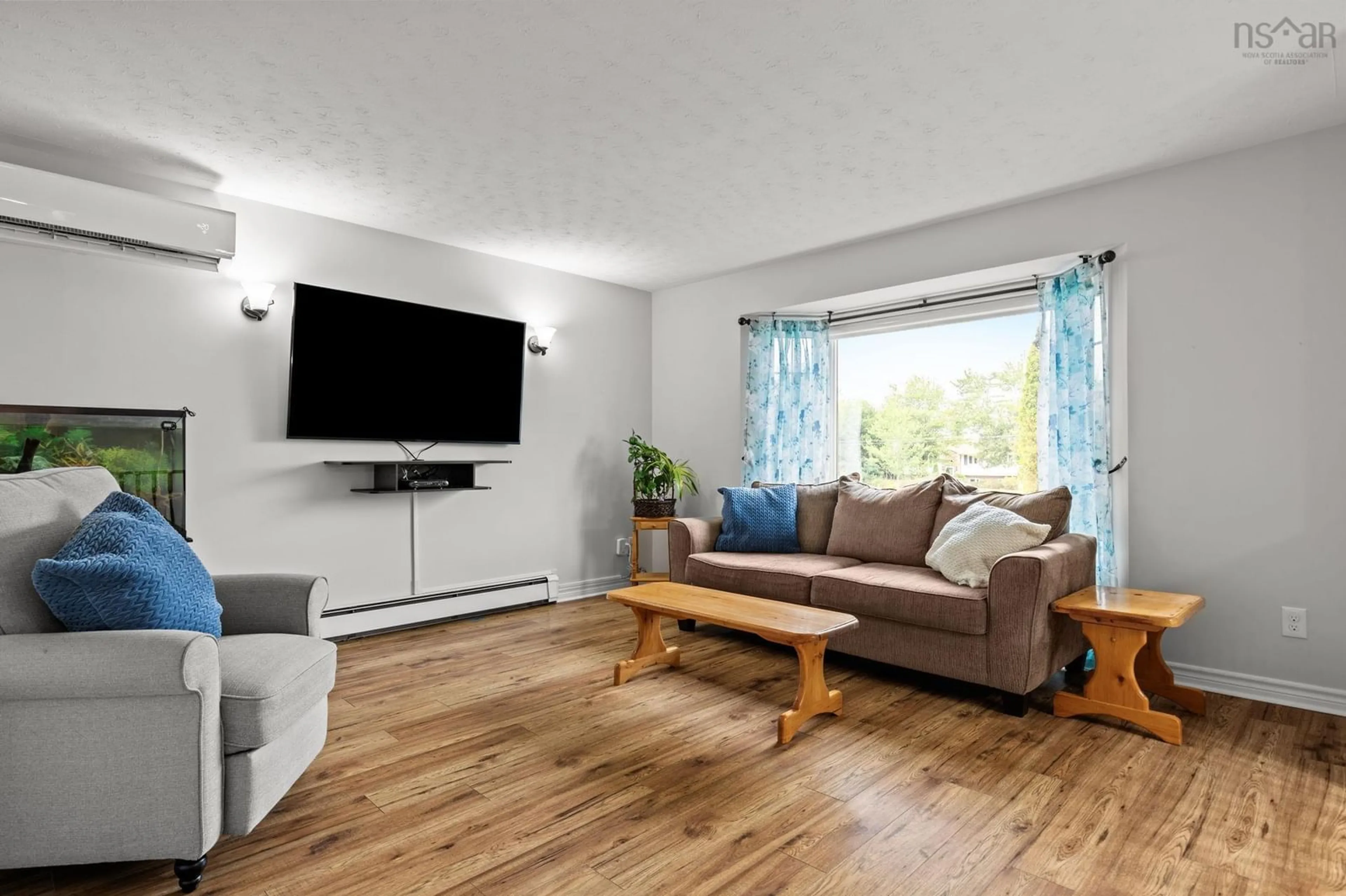 Living room with furniture, wood/laminate floor for 69 Michelle Dr, Lawrencetown Nova Scotia B2Z 1E5