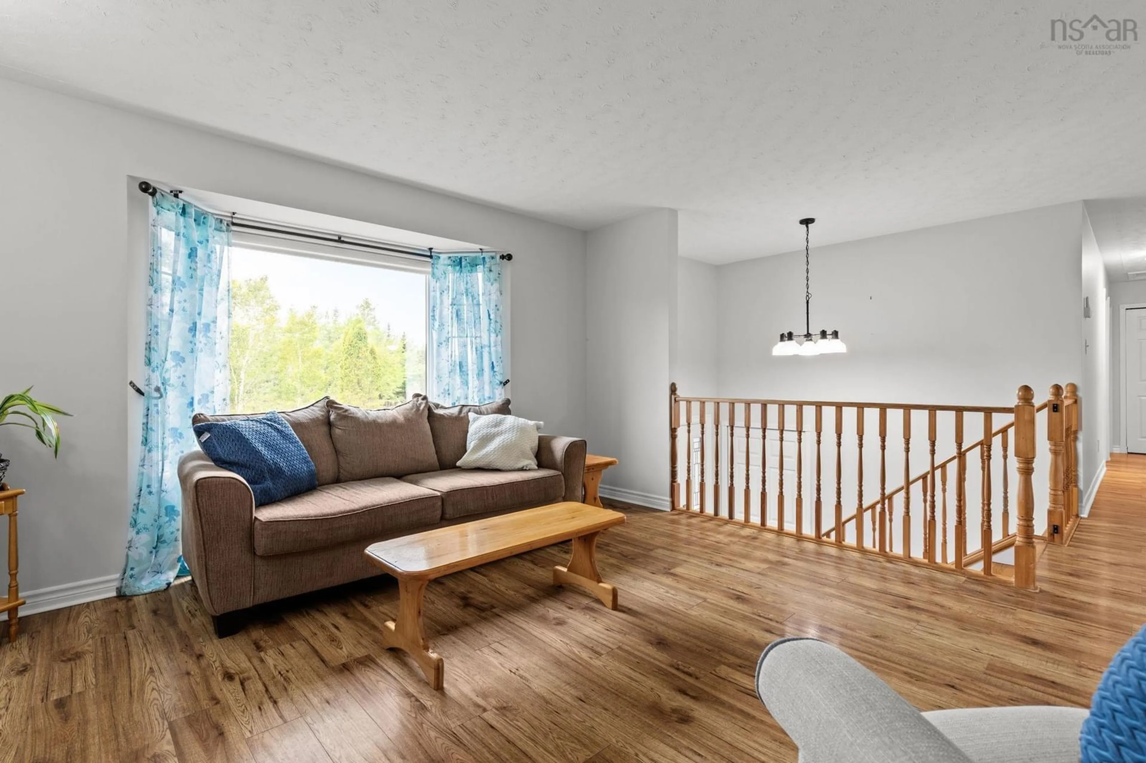 Living room with furniture, wood/laminate floor for 69 Michelle Dr, Lawrencetown Nova Scotia B2Z 1E5