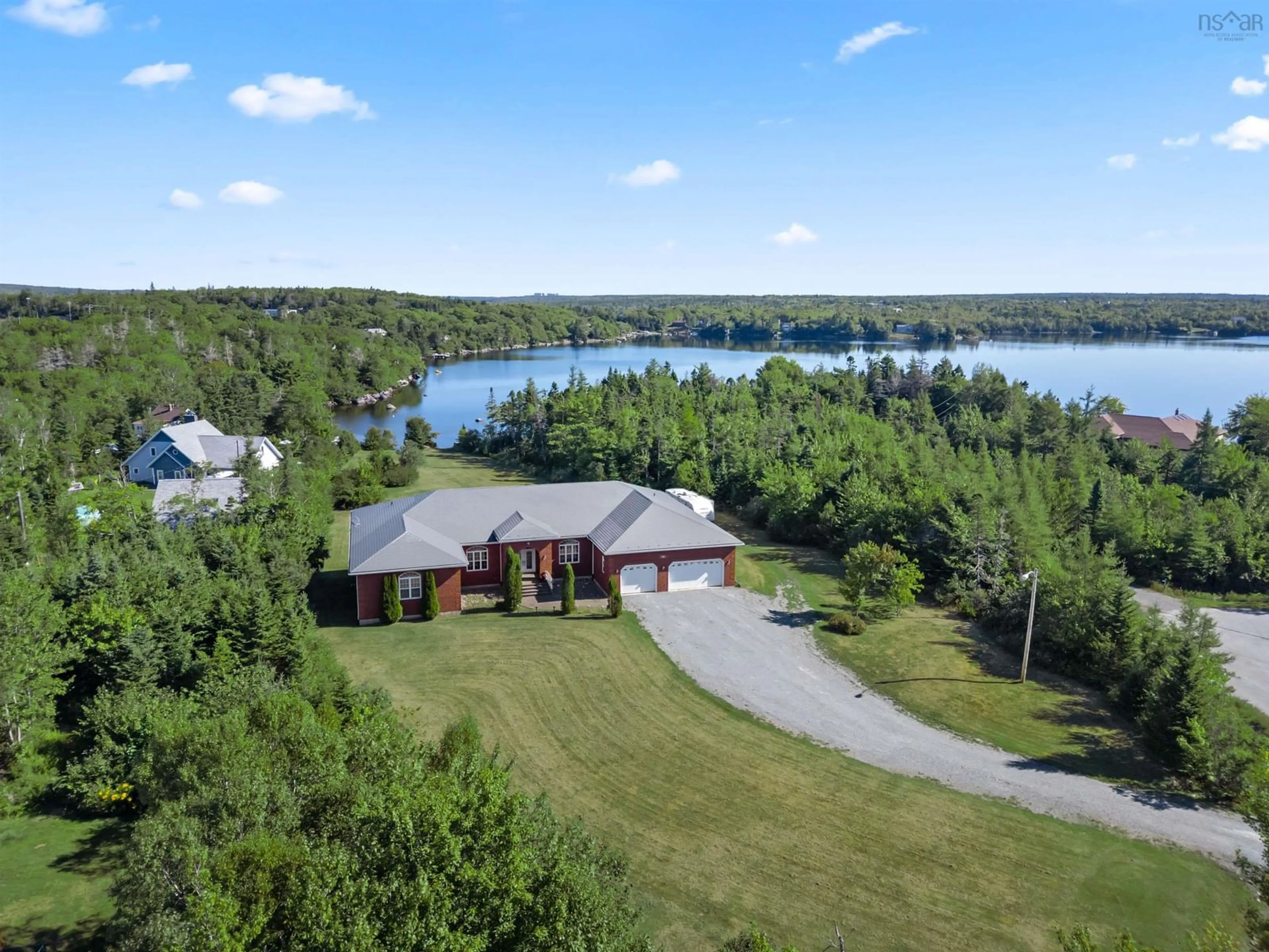A pic from outside/outdoor area/front of a property/back of a property/a pic from drone, water/lake/river/ocean view for 22 Mersey Crt, Hatchet Lake Nova Scotia B3T 1R7