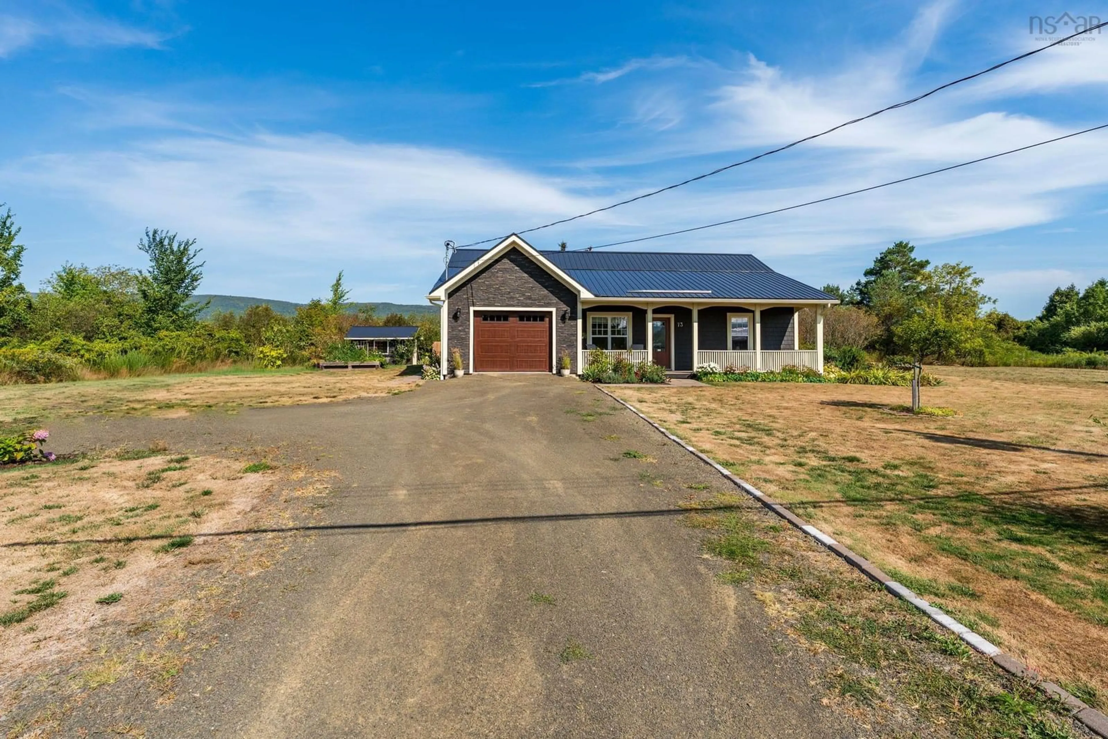 A pic from outside/outdoor area/front of a property/back of a property/a pic from drone, street for 73 Granville St, Bridgetown Nova Scotia B0S 1C0