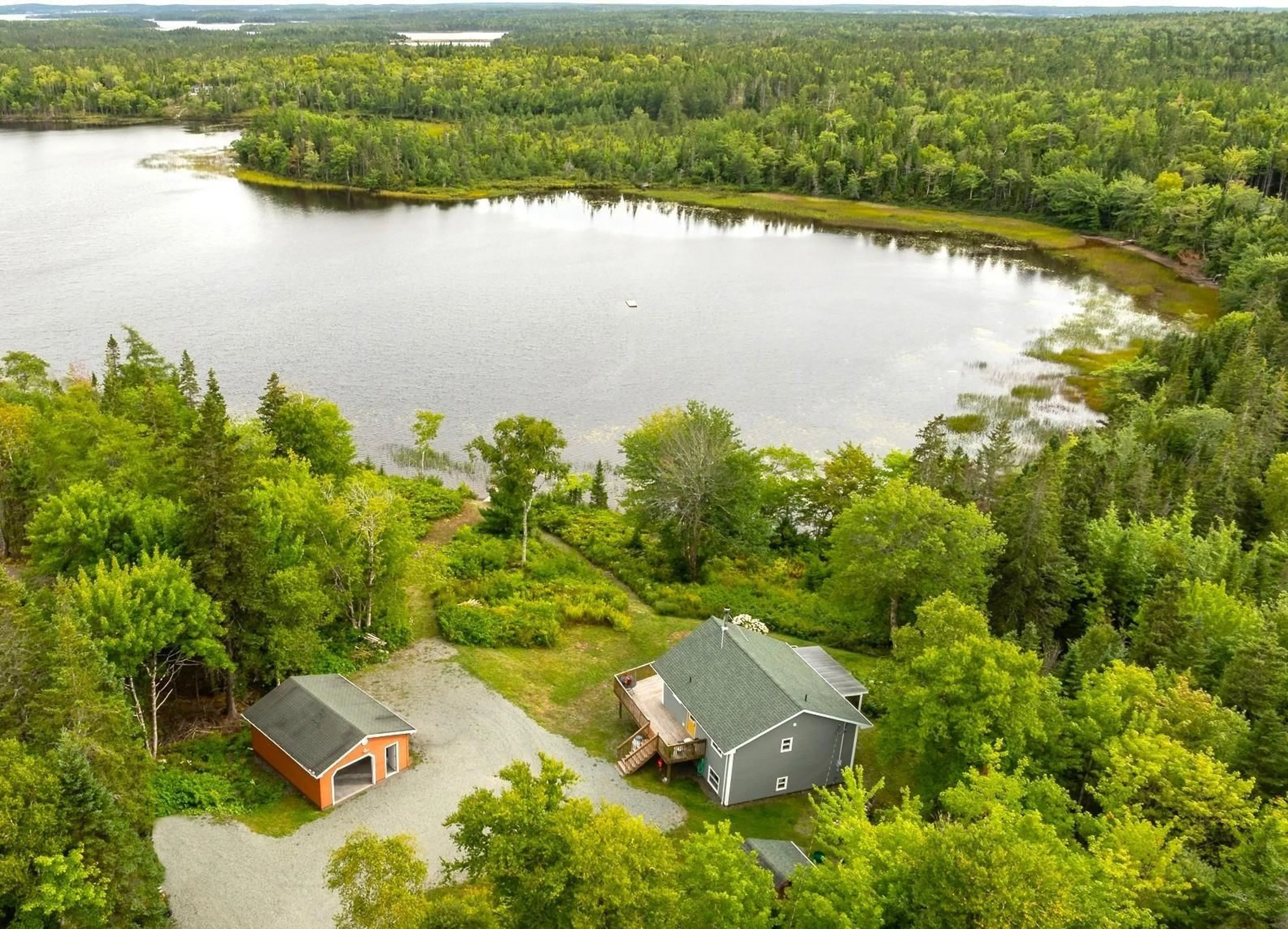 A pic from outside/outdoor area/front of a property/back of a property/a pic from drone, water/lake/river/ocean view for 44 Trout Lake Dr, Grande Anse Nova Scotia B0E 1V0