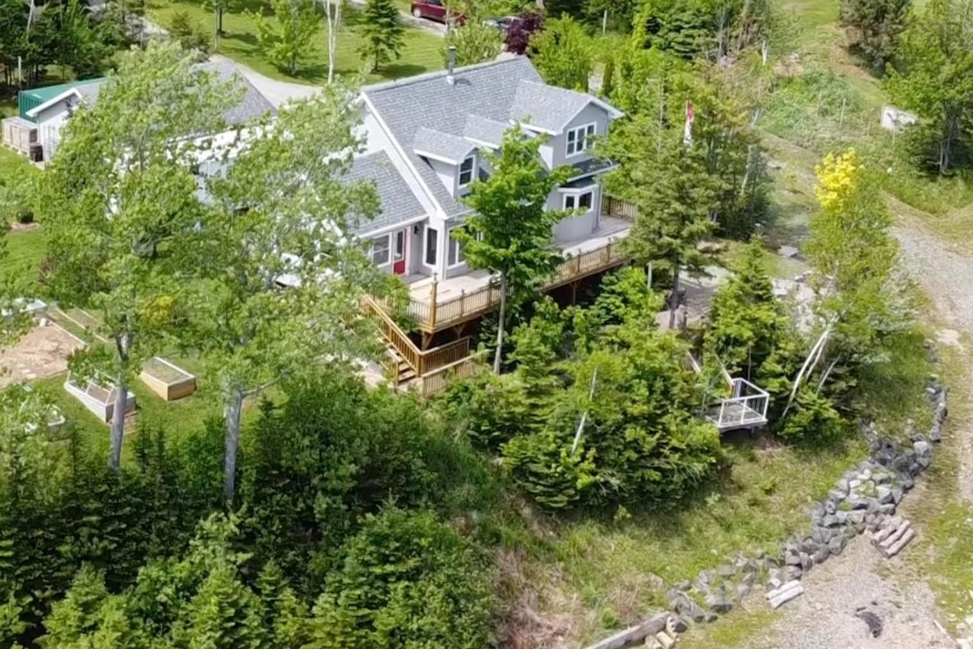 A pic from outside/outdoor area/front of a property/back of a property/a pic from drone, unknown for 5067 Kempt Head Rd, Southside Boularderie Nova Scotia B1Y 2P3
