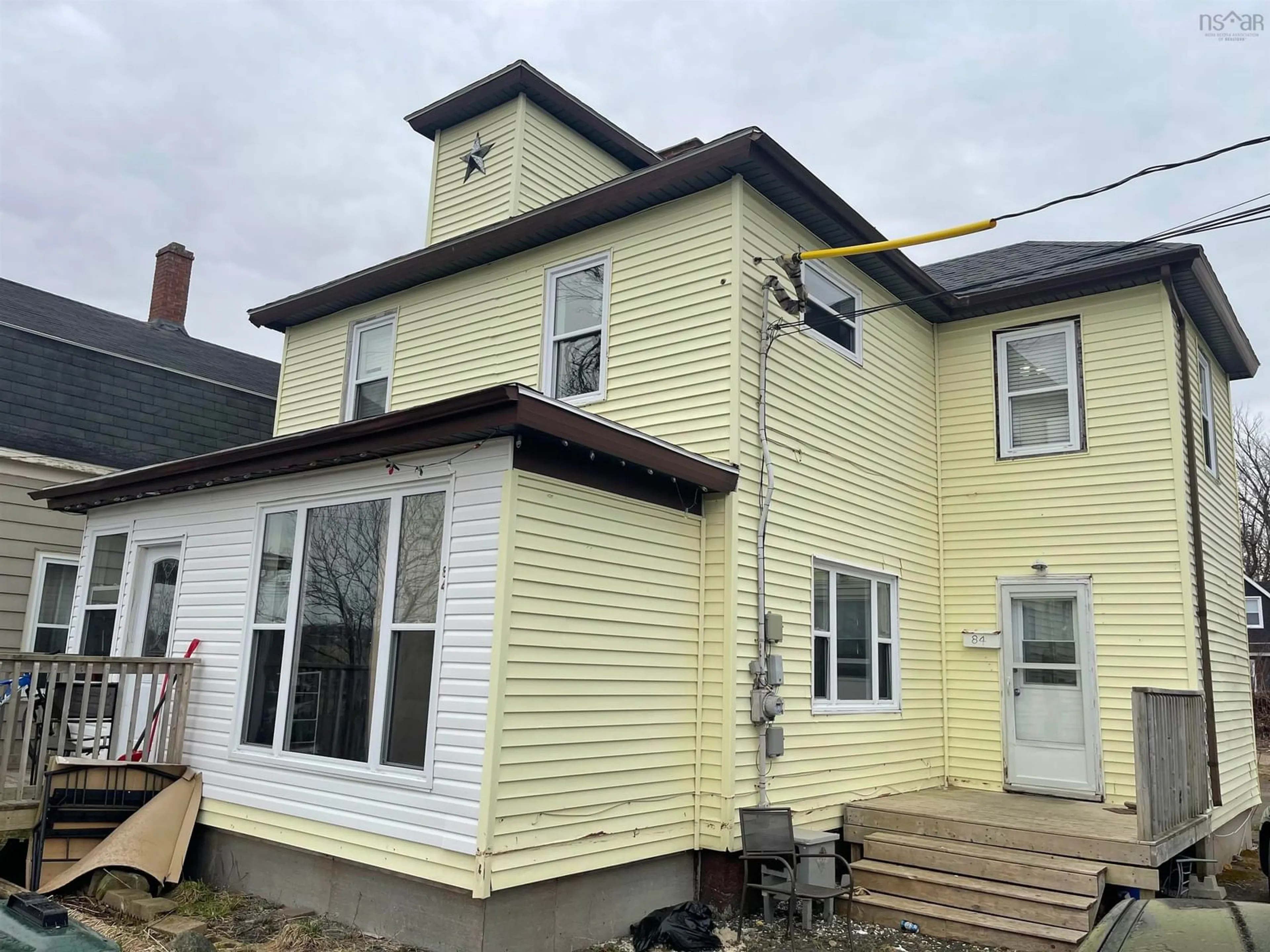 Home with vinyl exterior material, building for 84 Intercolonial St, Sydney Nova Scotia B1P 1S6