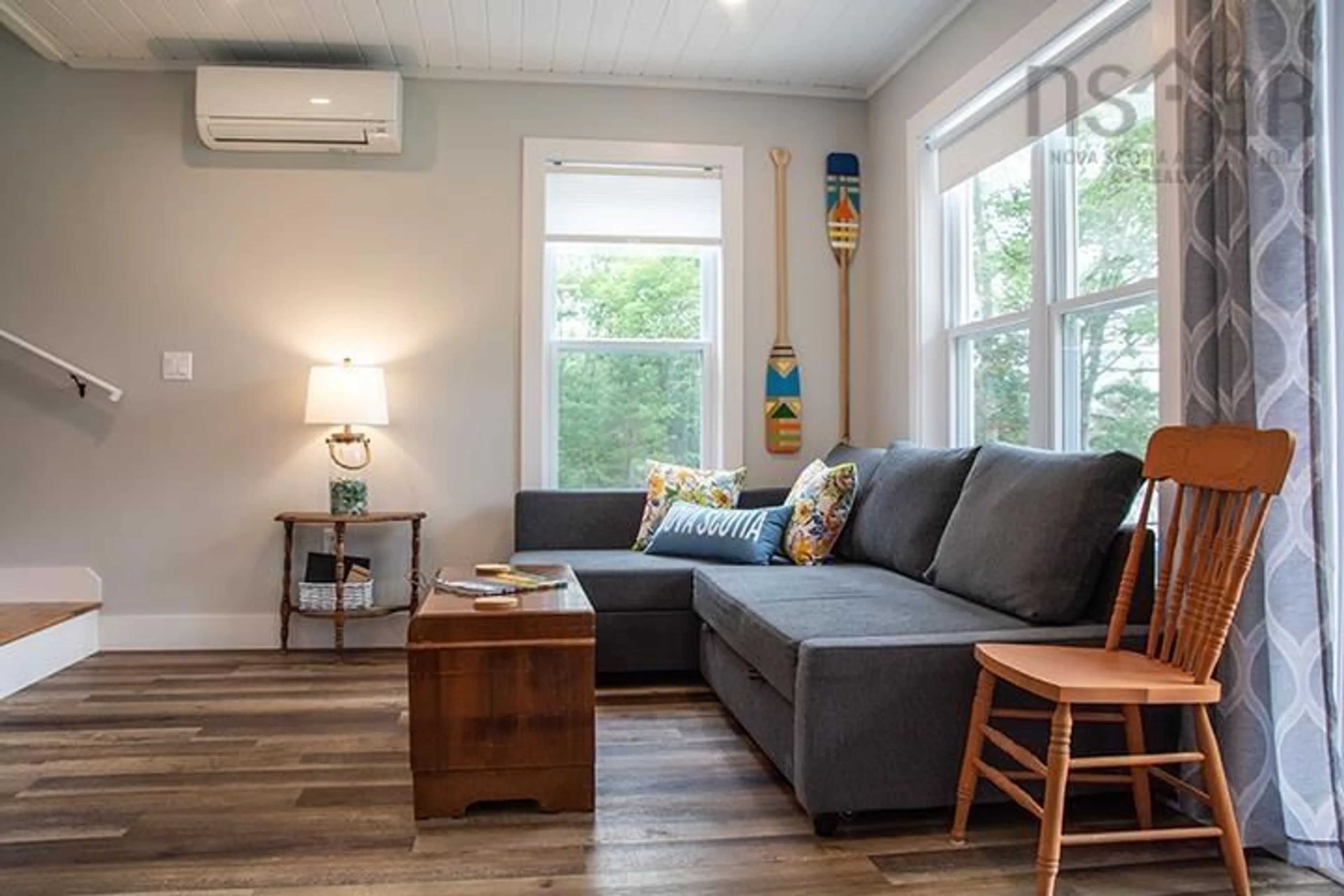 Living room with furniture, wood/laminate floor for 74 Meek Arm Trail, East Uniacke Nova Scotia B0N 1Z0