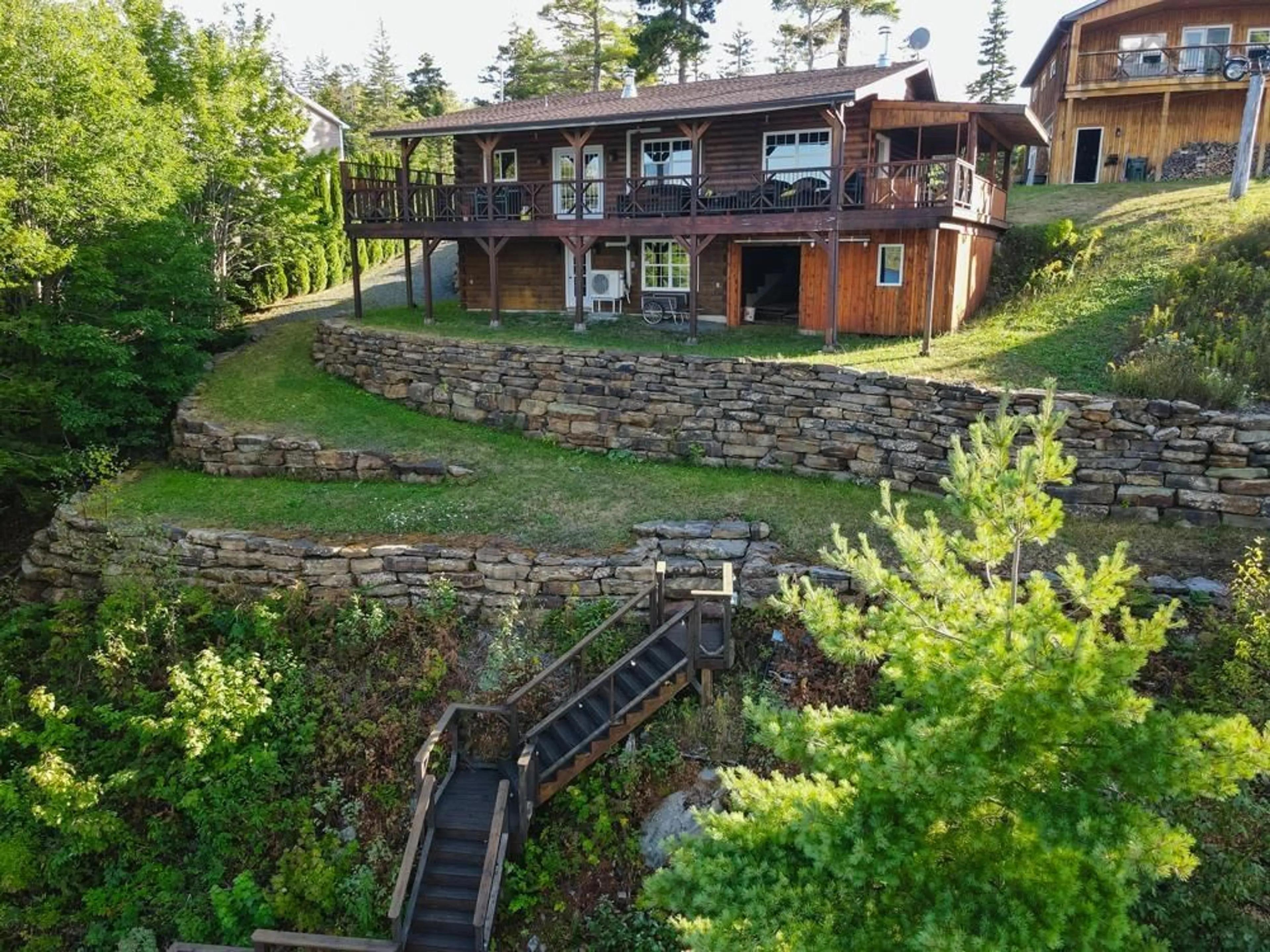 A pic from outside/outdoor area/front of a property/back of a property/a pic from drone, water/lake/river/ocean view for 169 Cockscomb Lake Dr, Mount Uniacke Nova Scotia B0N 1Z0