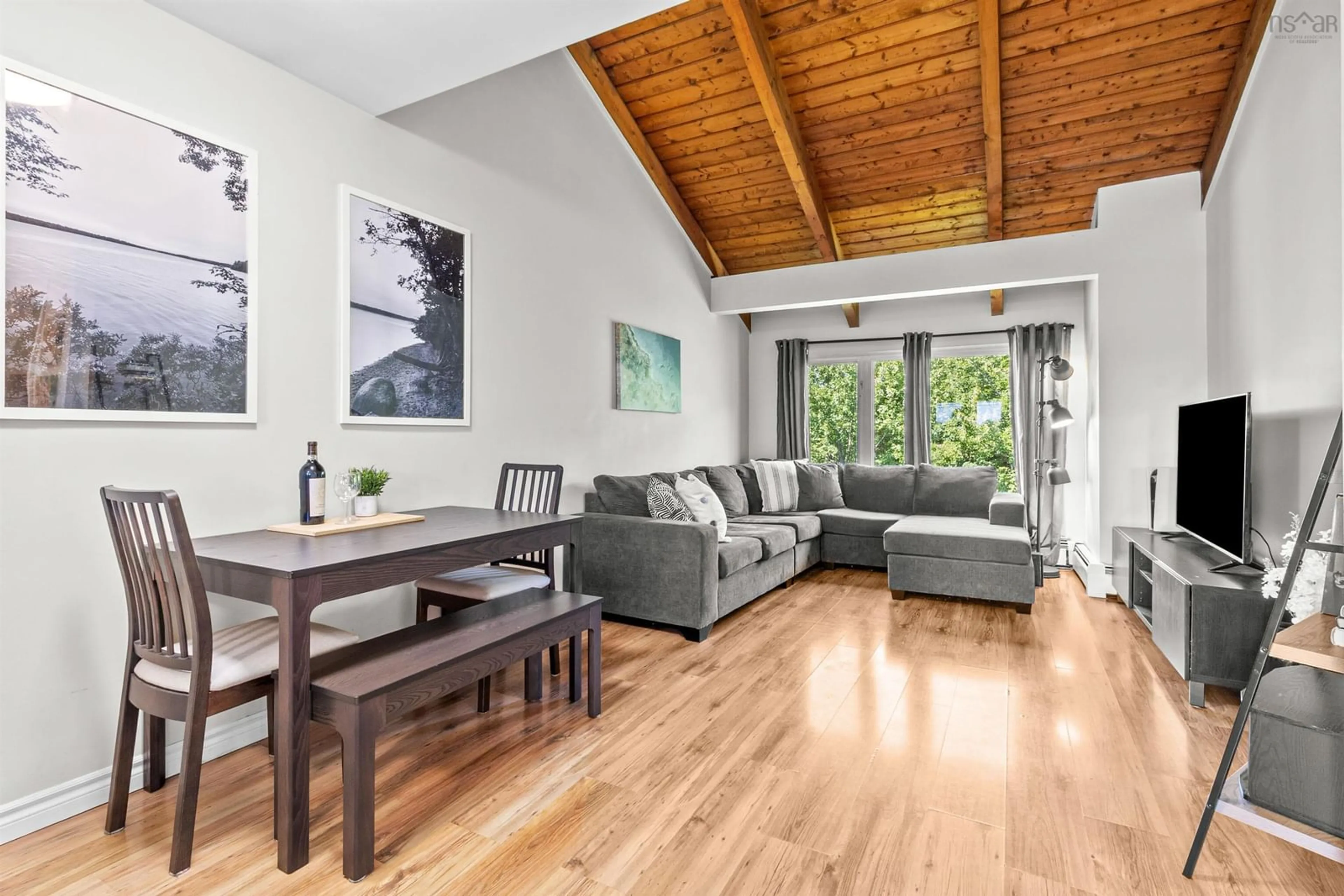 Living room with furniture, wood/laminate floor for 57 Clermont Cres, Forest Hills Nova Scotia B2W 4N9