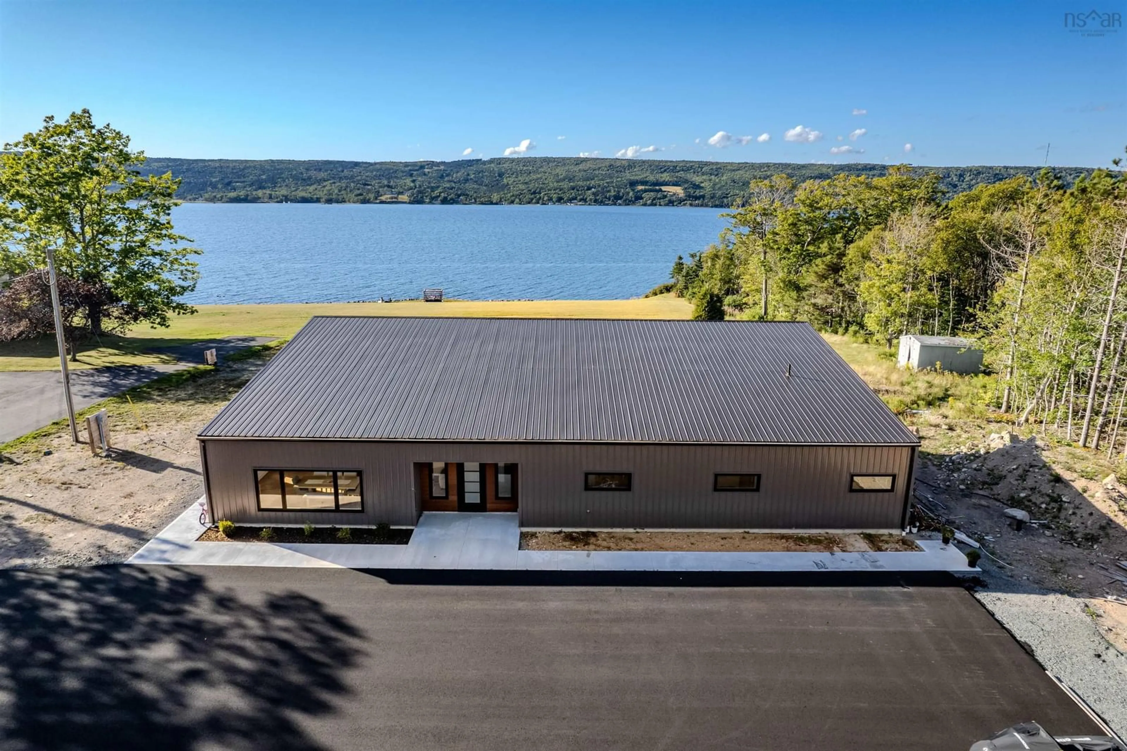 A pic from outside/outdoor area/front of a property/back of a property/a pic from drone, water/lake/river/ocean view for 5416 East Bay Hwy, Ben Eoin Nova Scotia B1J 1P4