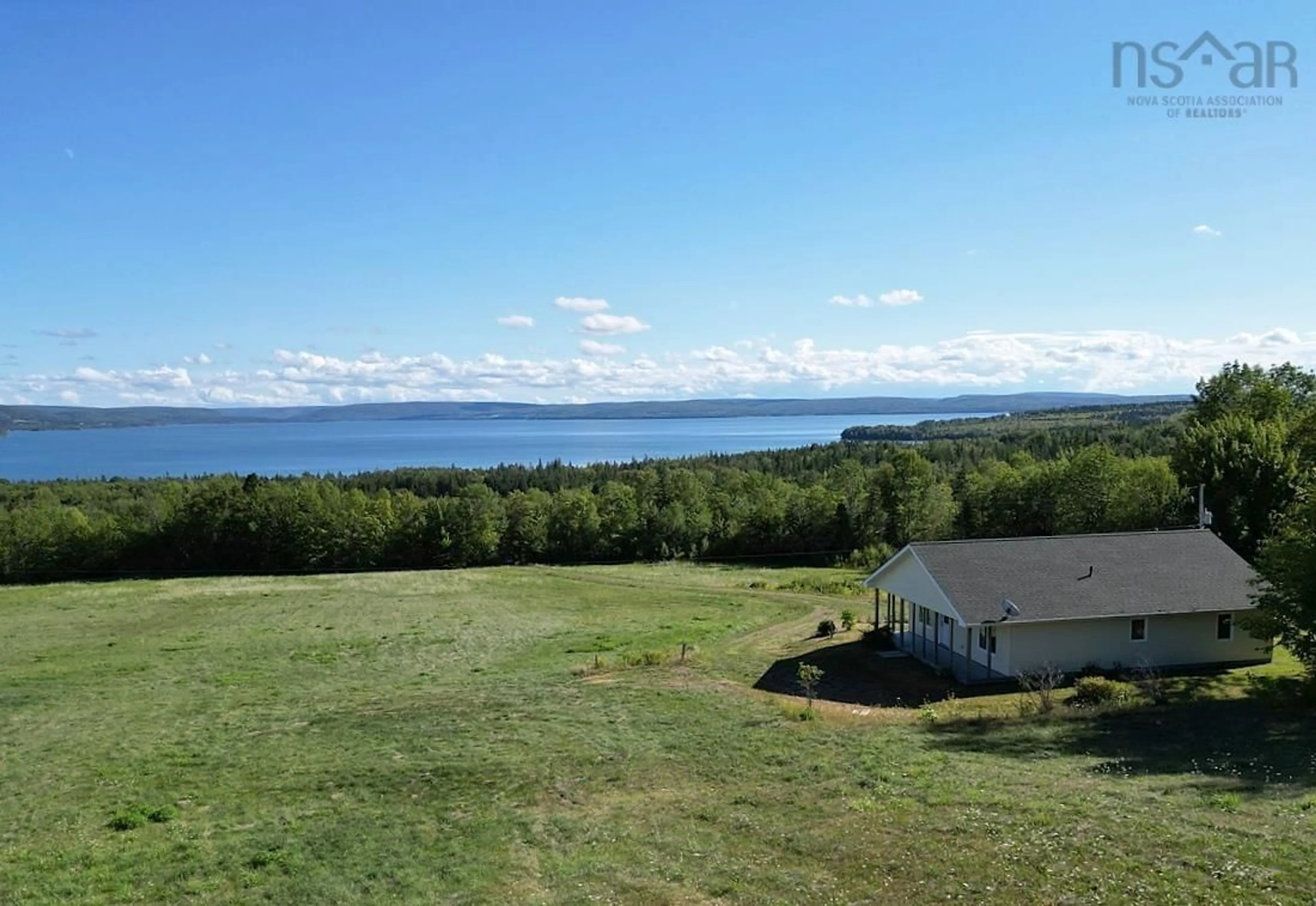 A pic from outside/outdoor area/front of a property/back of a property/a pic from drone, water/lake/river/ocean view for 111 Loop Of The Strathlorne-Scotsville Rd, North Lake Ainslie Nova Scotia B0E 1N0