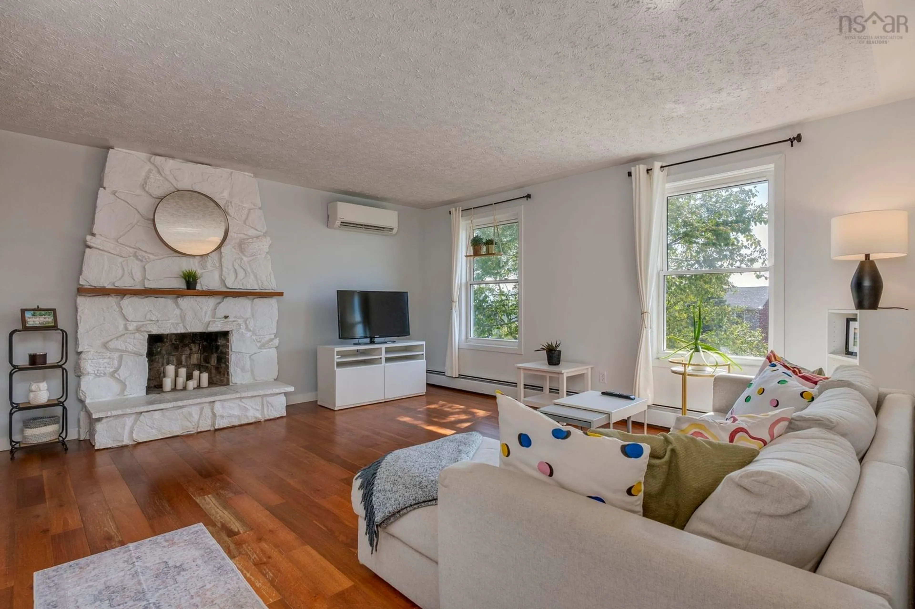 Living room with furniture, wood/laminate floor for 98 Collins Grove, Dartmouth Nova Scotia B2W 4E6