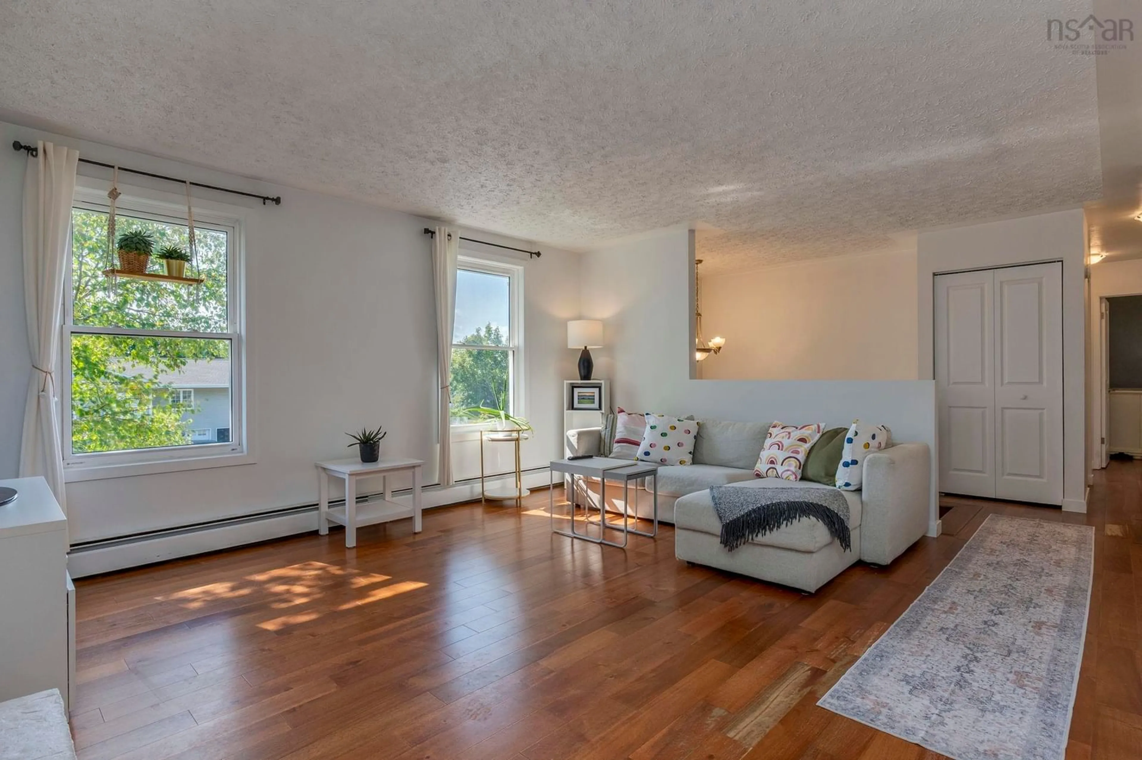 Living room with furniture, wood/laminate floor for 98 Collins Grove, Dartmouth Nova Scotia B2W 4E6