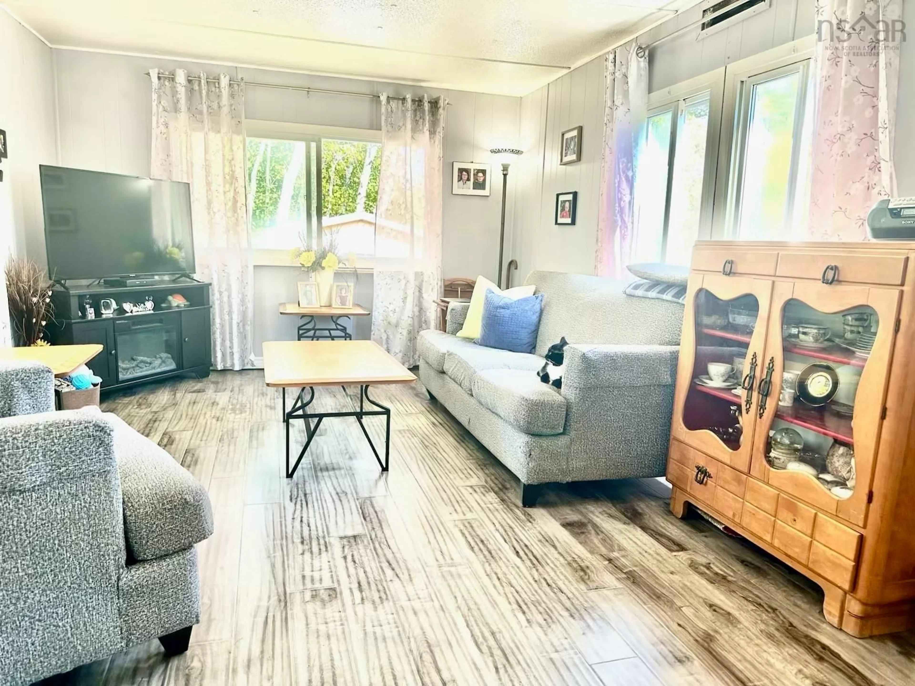 Living room with furniture, wood/laminate floor for 7571 Highway 354, North Noel Road Nova Scotia B0N 1T0