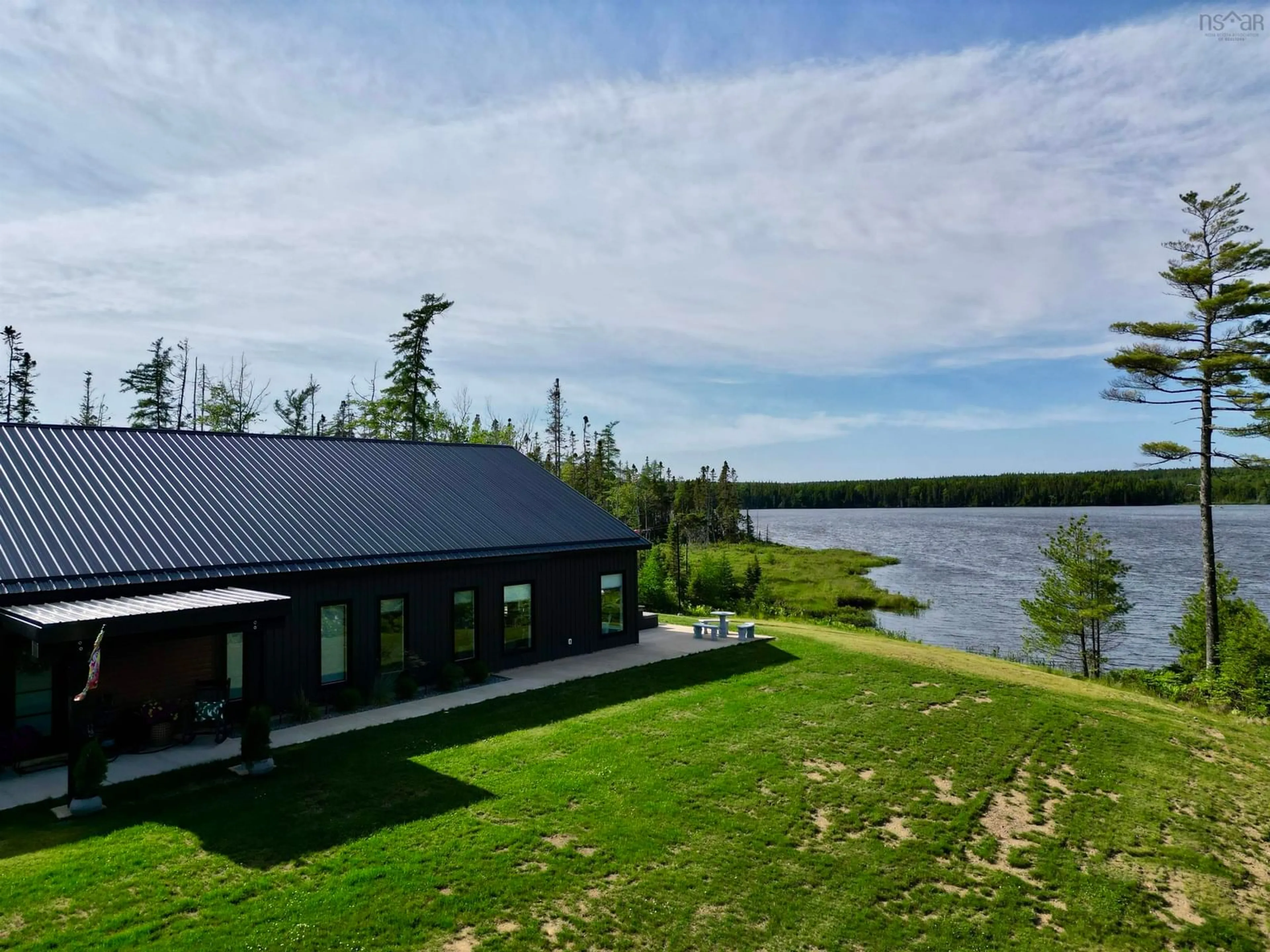 A pic from outside/outdoor area/front of a property/back of a property/a pic from drone, water/lake/river/ocean view for 381 Grandiqe Ferry Rd., Louisdale Nova Scotia B0E 1V0