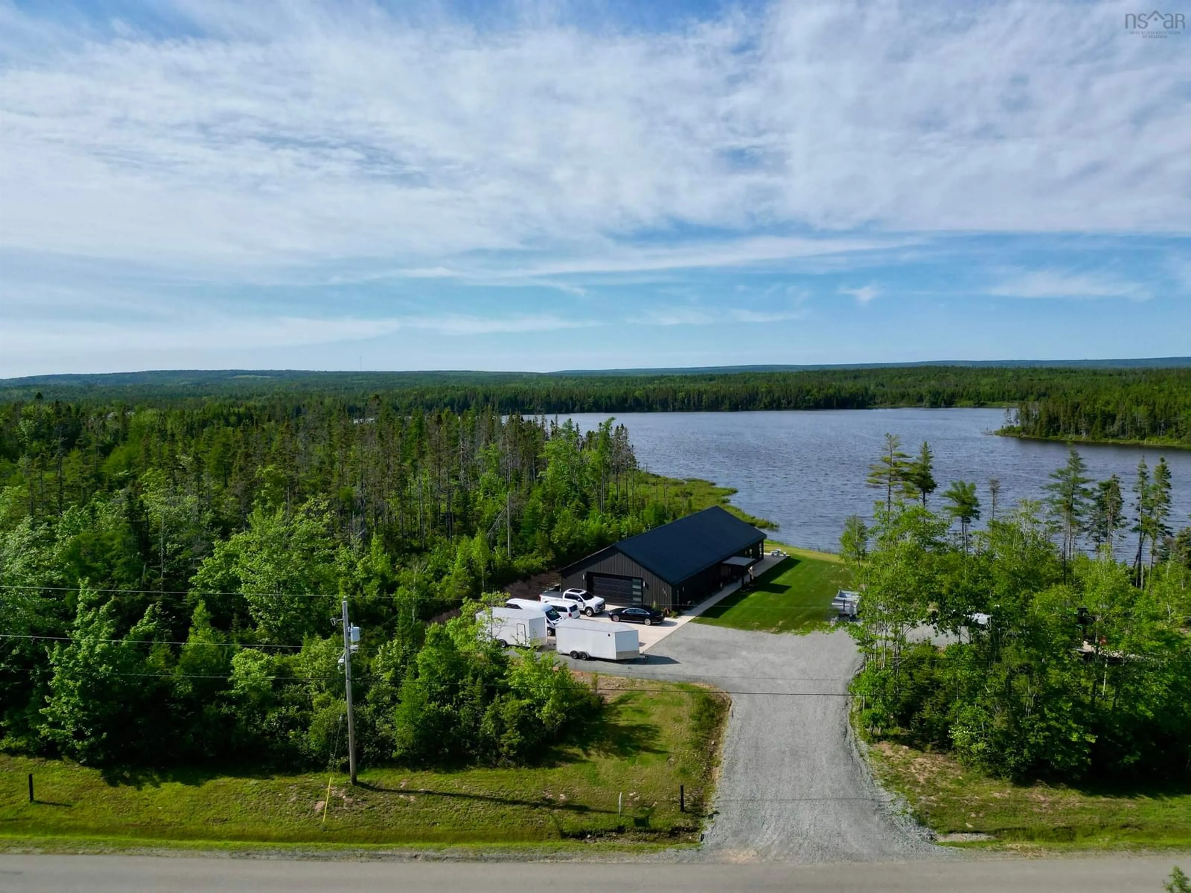 A pic from outside/outdoor area/front of a property/back of a property/a pic from drone, water/lake/river/ocean view for 381 Grandiqe Ferry Rd., Louisdale Nova Scotia B0E 1V0