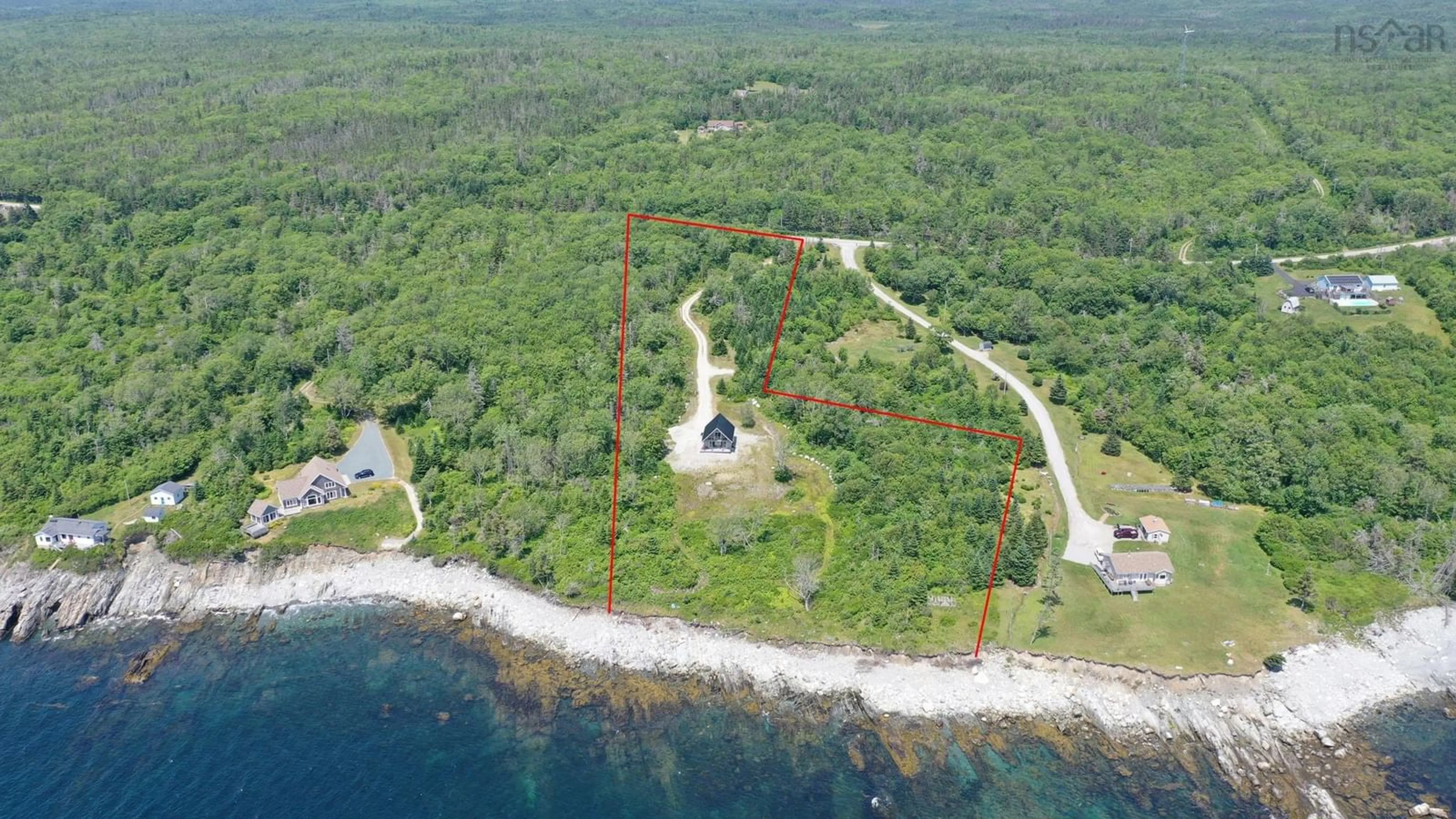 A pic from outside/outdoor area/front of a property/back of a property/a pic from drone, water/lake/river/ocean view for 2406 Sandy Point Rd, Lower Sandy Point Nova Scotia B0T 1W0