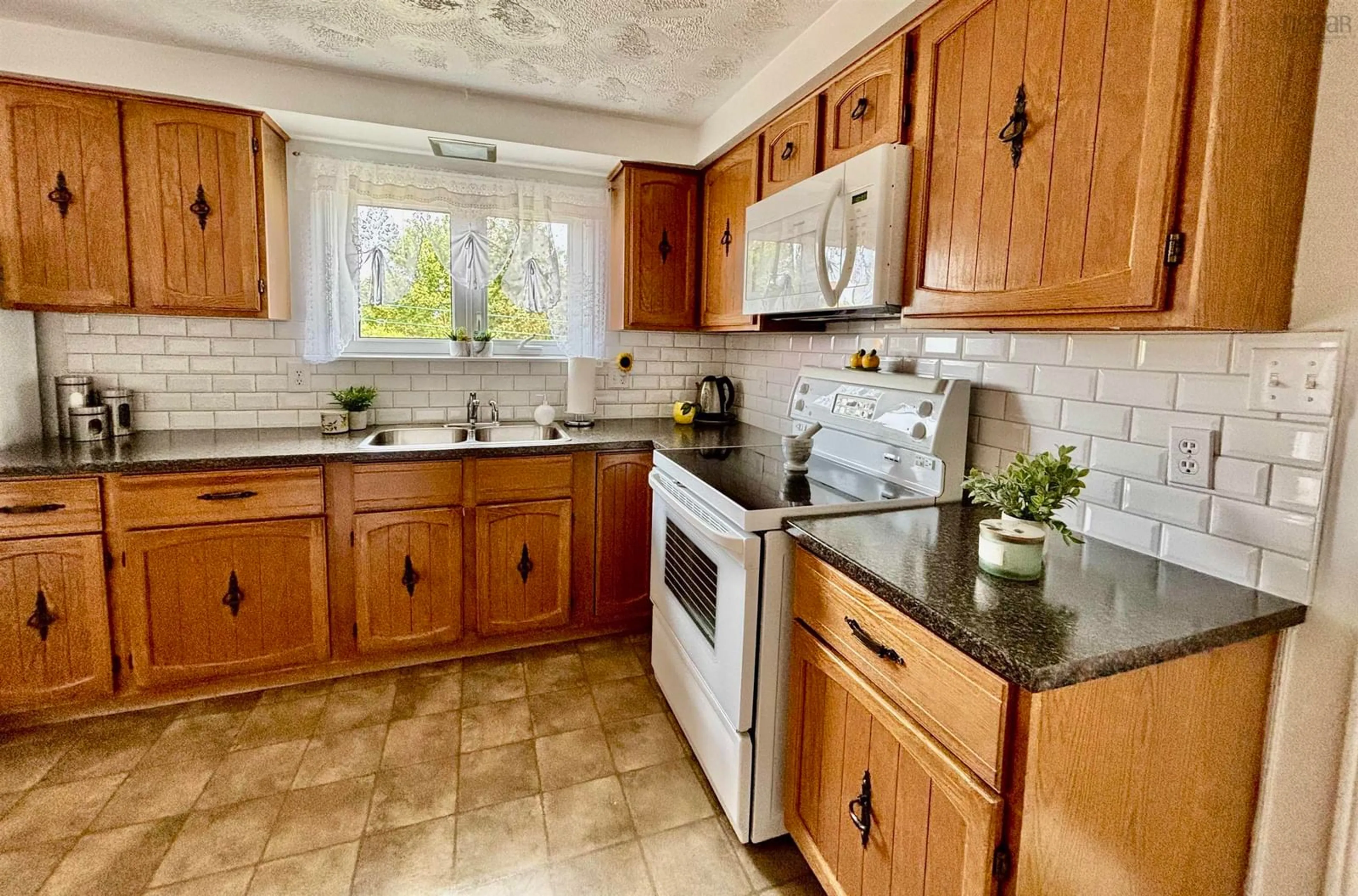 Standard kitchen, ceramic/tile floor for 41 Helens Ave, Georges River Nova Scotia B1Y 3G5