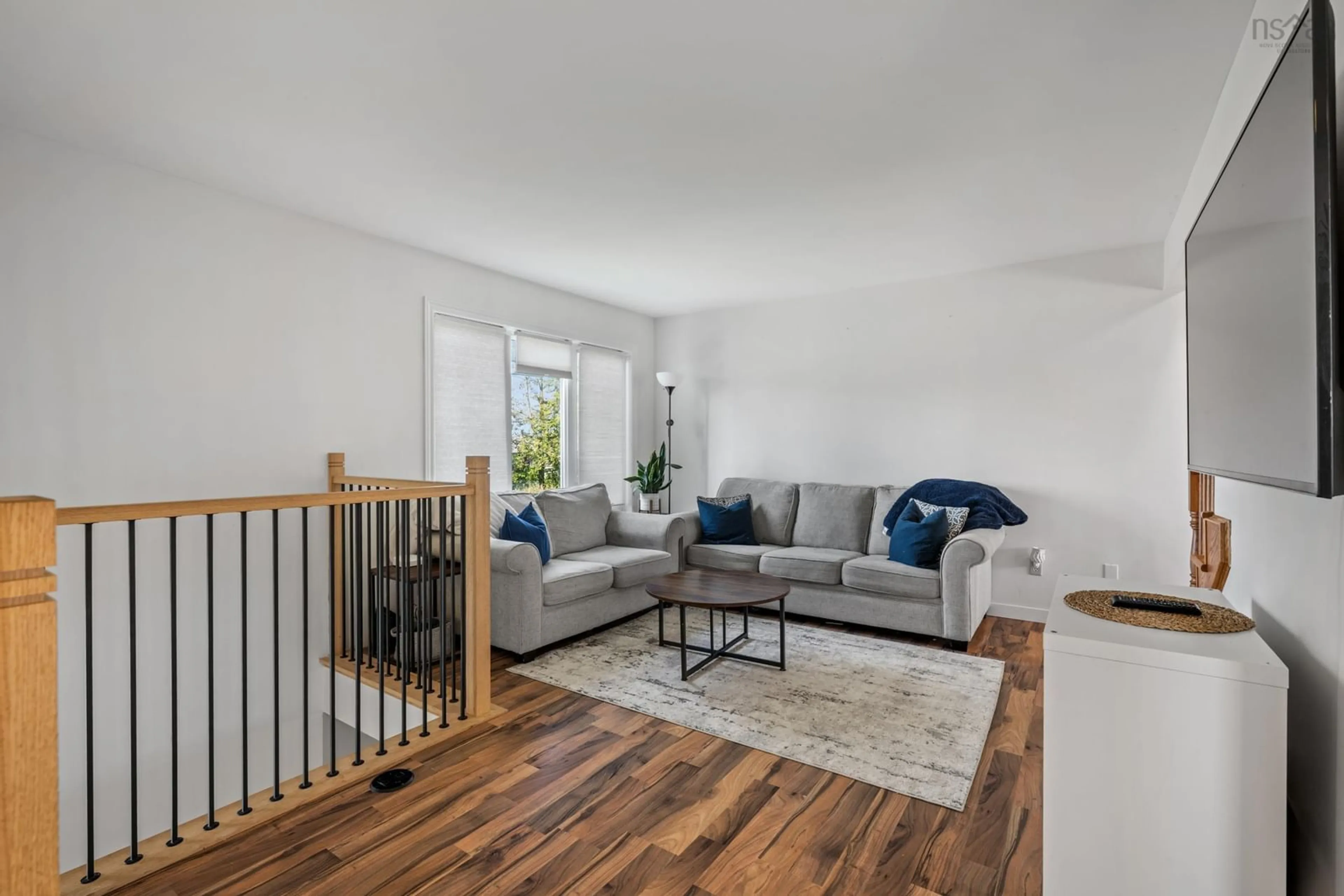 Living room with furniture, wood/laminate floor for 2066 Caldwell Rd, Eastern Passage Nova Scotia B3G 1H7