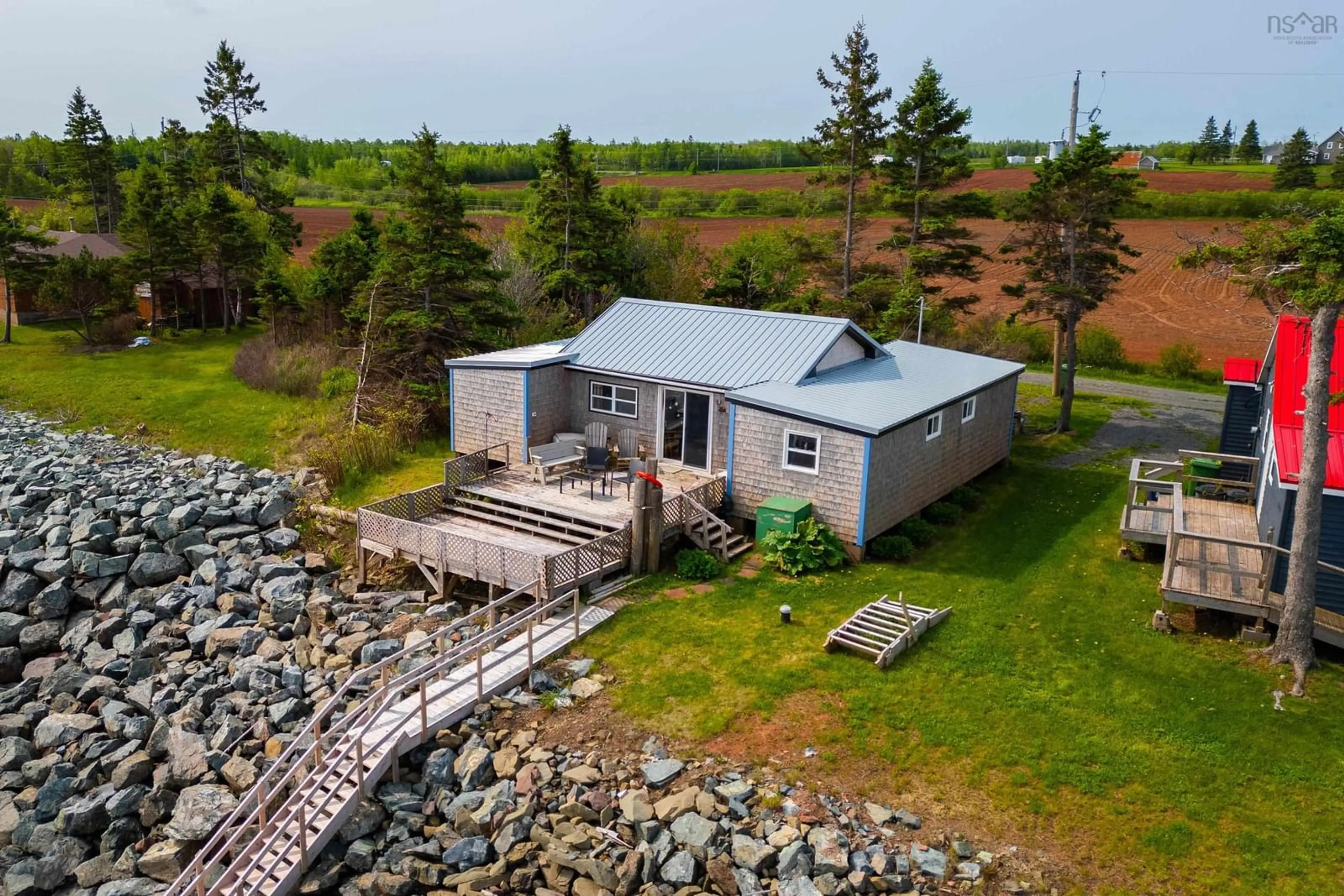 A pic from outside/outdoor area/front of a property/back of a property/a pic from drone, water/lake/river/ocean view for 85 Ridgway Lane, Northport Nova Scotia B0L 0A3