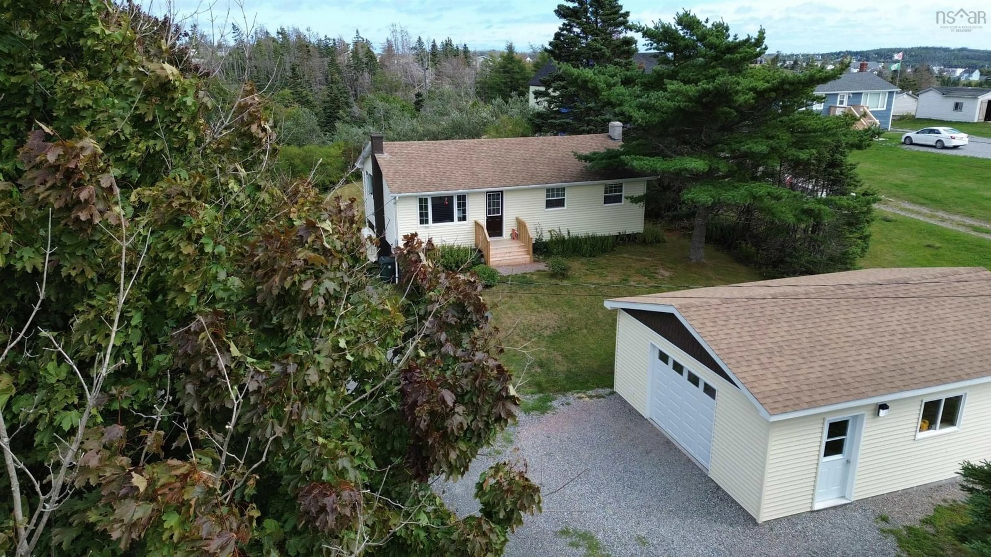 A pic from outside/outdoor area/front of a property/back of a property/a pic from drone, unknown for 56 Riverdale St, Louisbourg Nova Scotia B1C 2J1