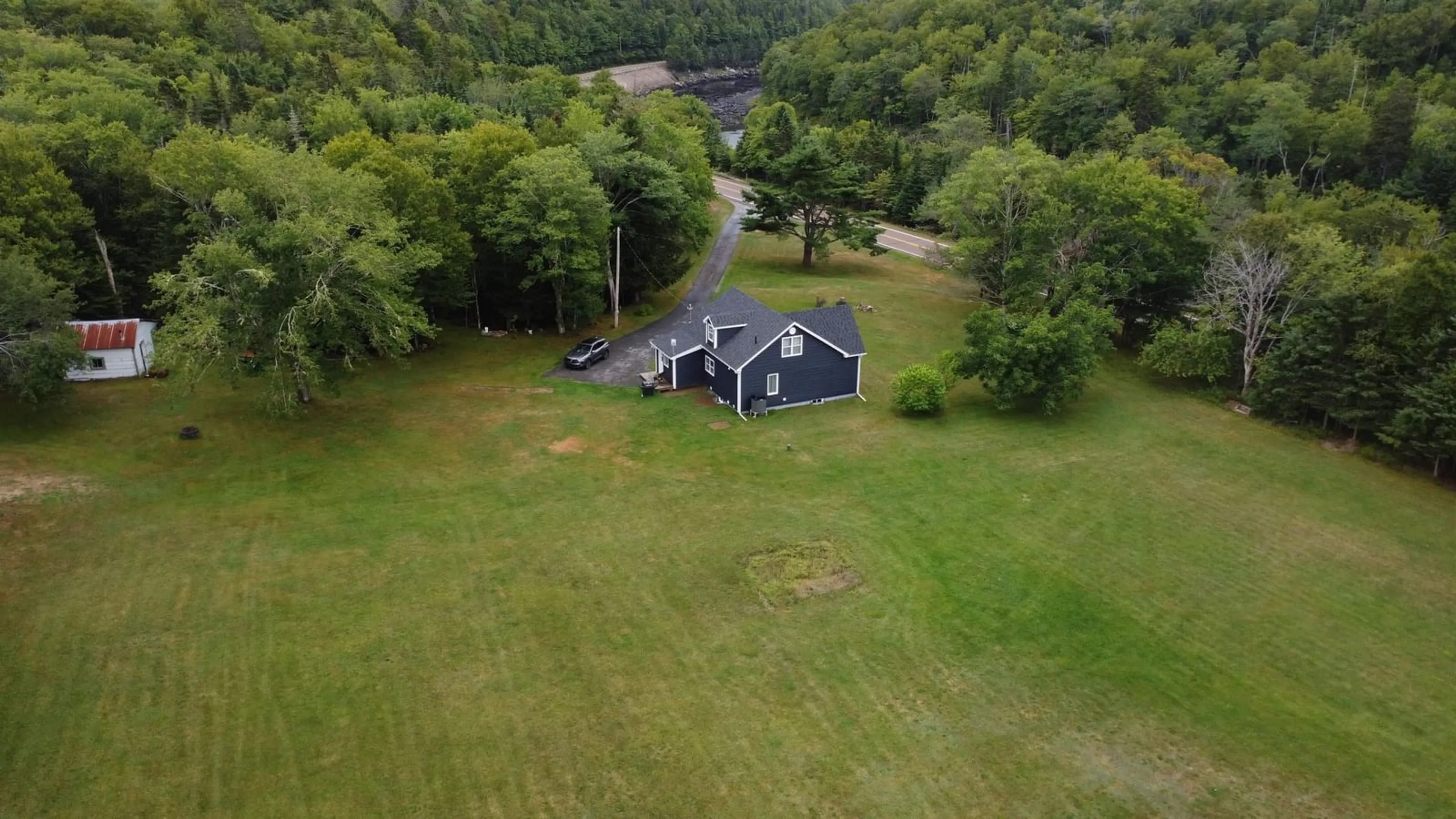 A pic from outside/outdoor area/front of a property/back of a property/a pic from drone, unknown for 8664 Highway 7, Sherbrooke Nova Scotia B0J 3C0