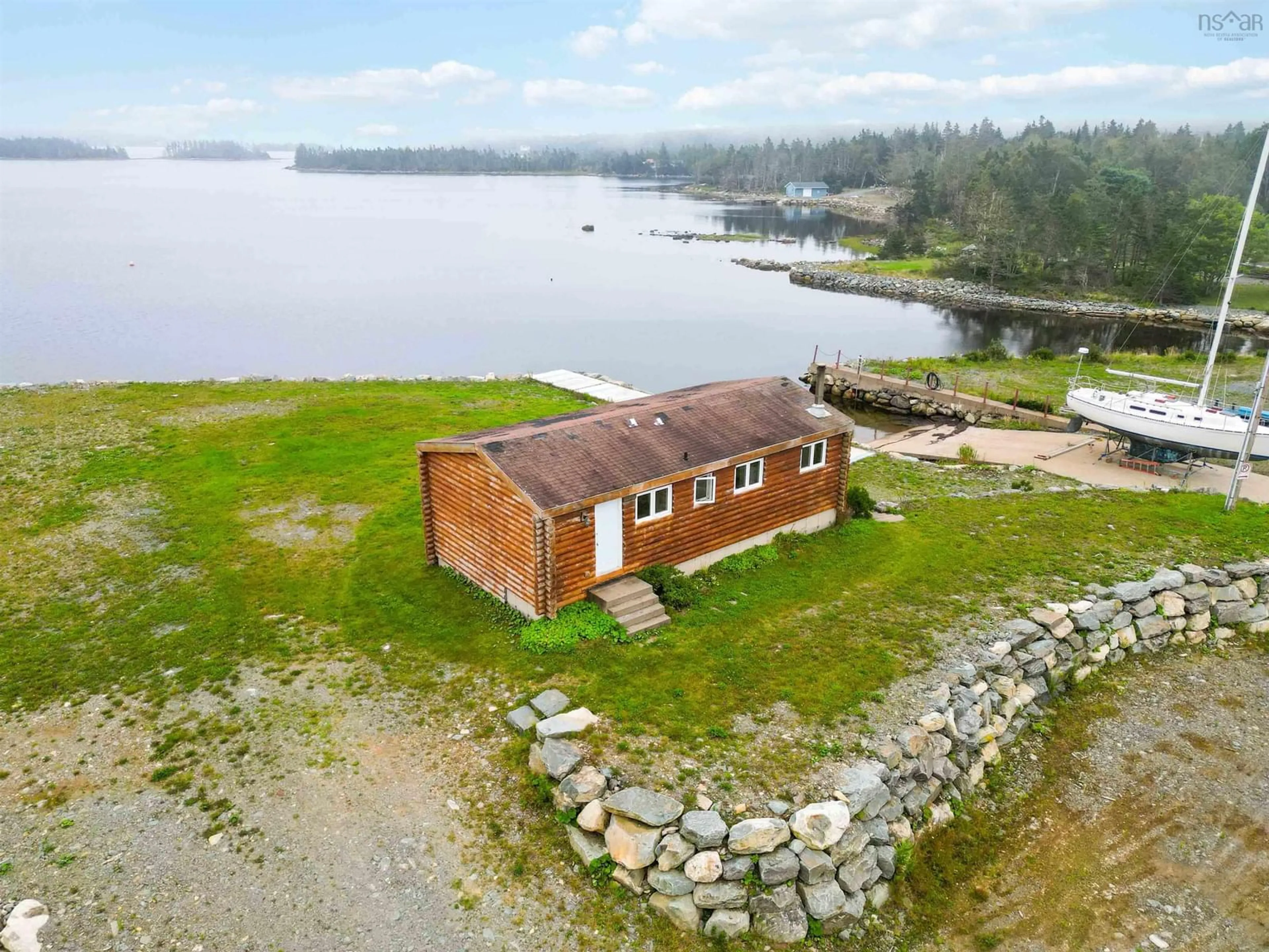 A pic from outside/outdoor area/front of a property/back of a property/a pic from drone, water/lake/river/ocean view for 1199 West Jeddore Rd, West Jeddore Nova Scotia B0J 1P0