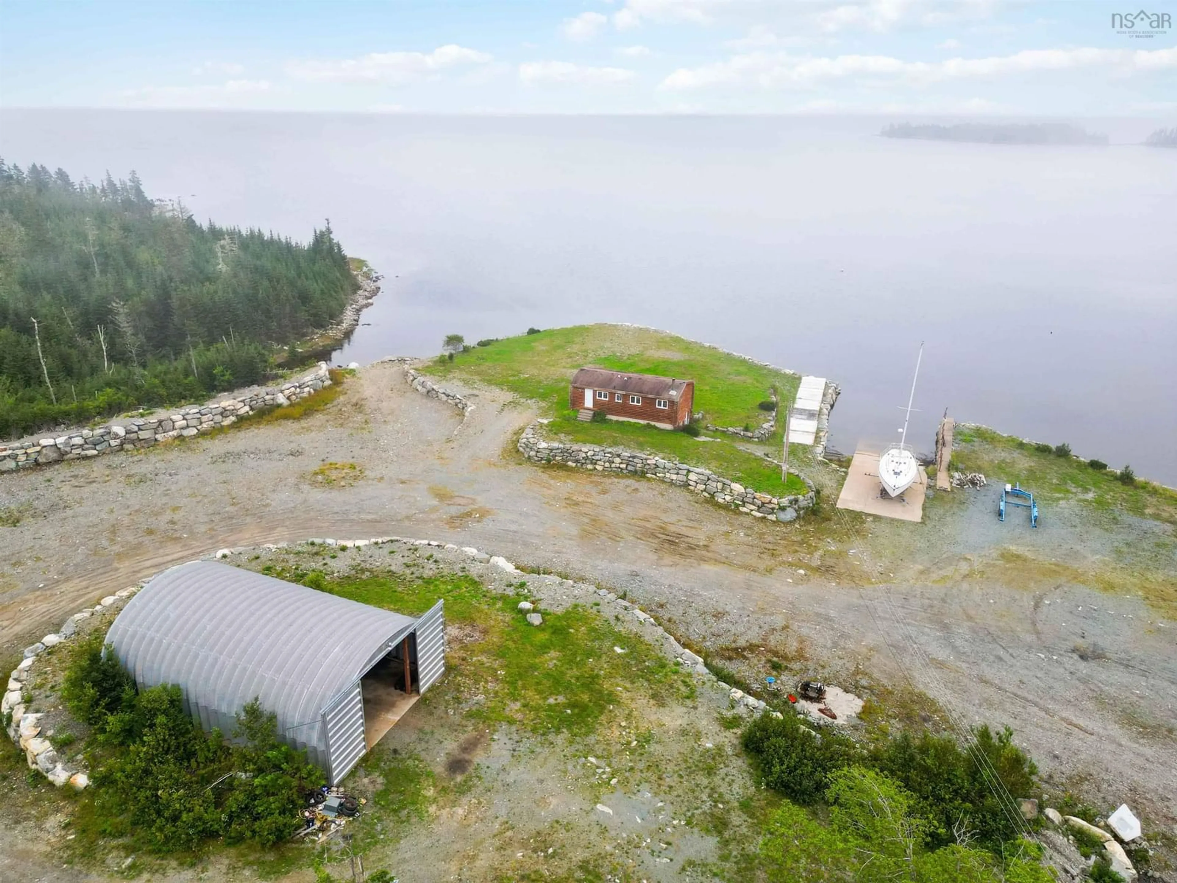 A pic from outside/outdoor area/front of a property/back of a property/a pic from drone, water/lake/river/ocean view for 1199 West Jeddore Rd, West Jeddore Nova Scotia B0J 1P0