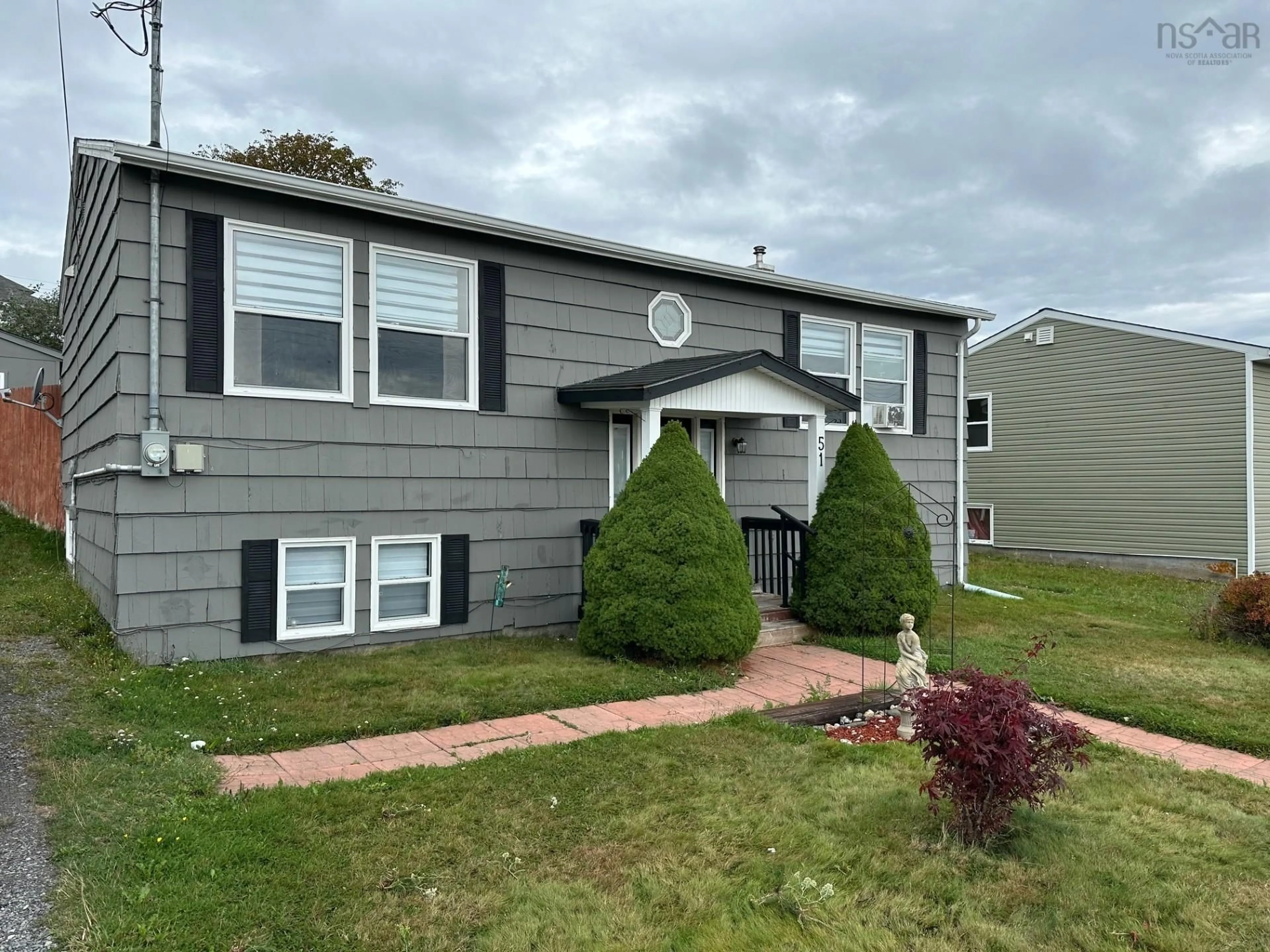 Home with vinyl exterior material, street for 51 Centennial St, Canso Nova Scotia B0H 1H0