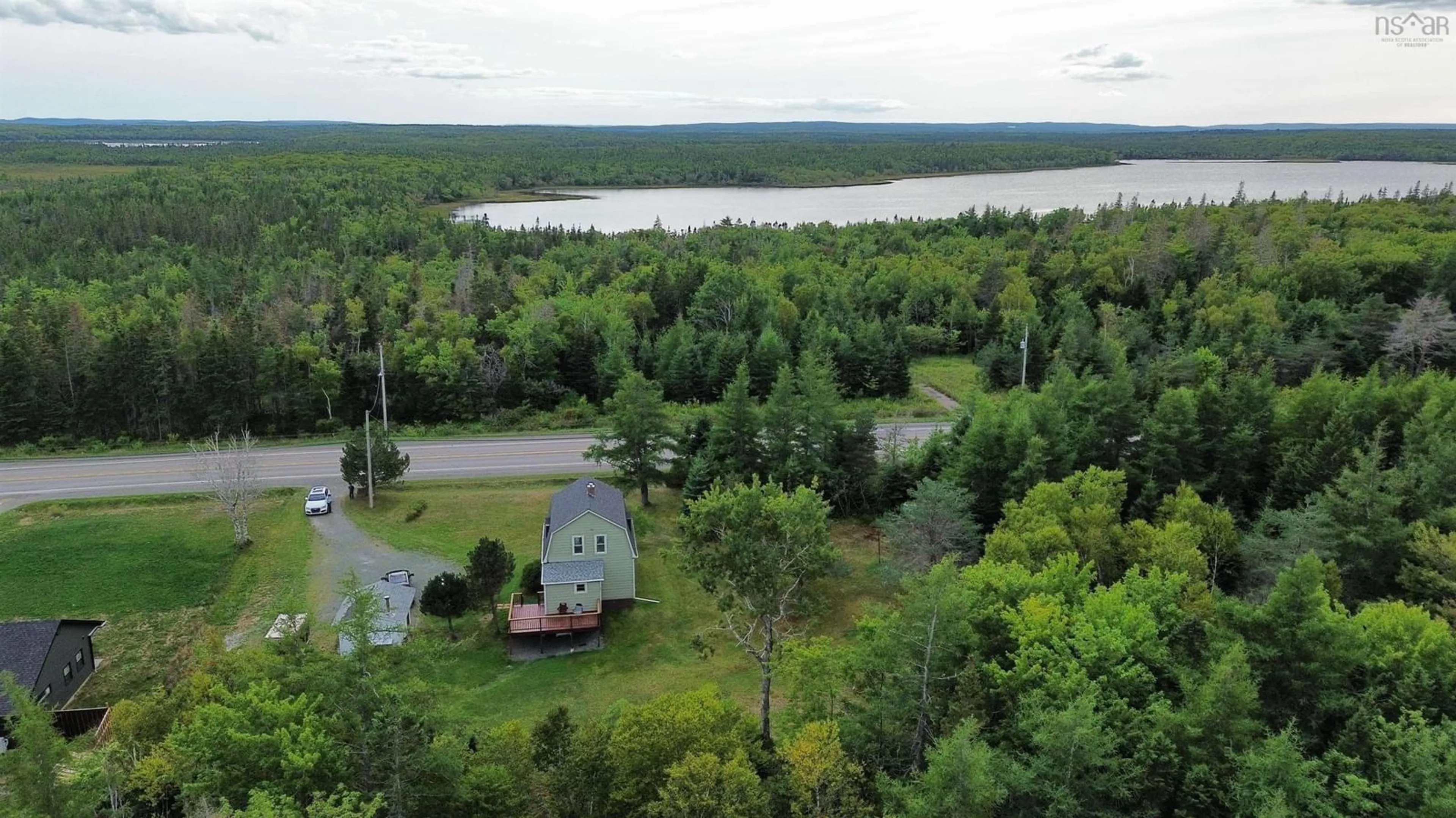 A pic from outside/outdoor area/front of a property/back of a property/a pic from drone, water/lake/river/ocean view for 2559 Highway 22, Mira Road Nova Scotia B1M 1B1