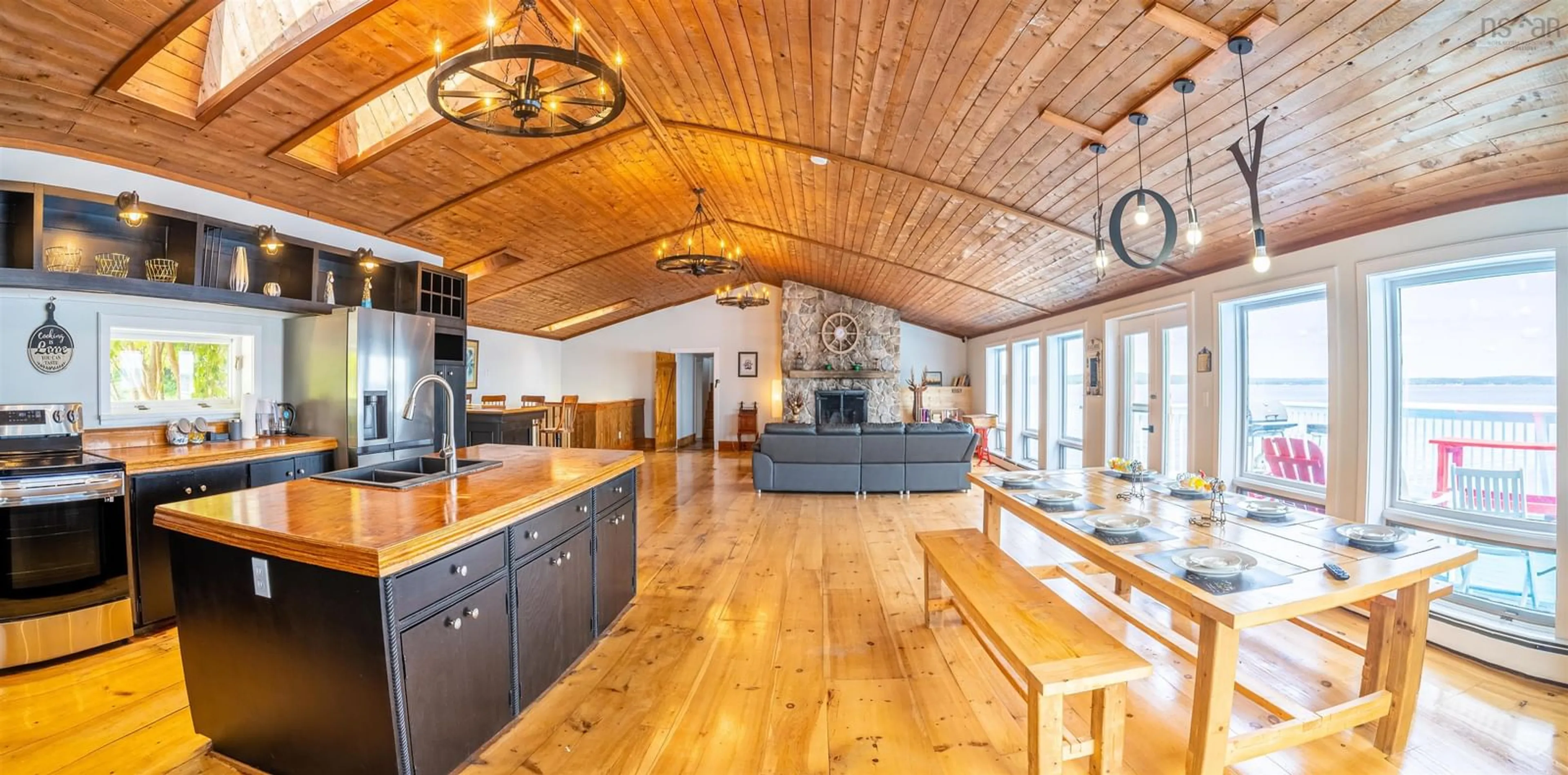 Open concept kitchen, wood/laminate floor for 501 Mill Cove Shore Rd, Birchy Head Nova Scotia B0J 1T0