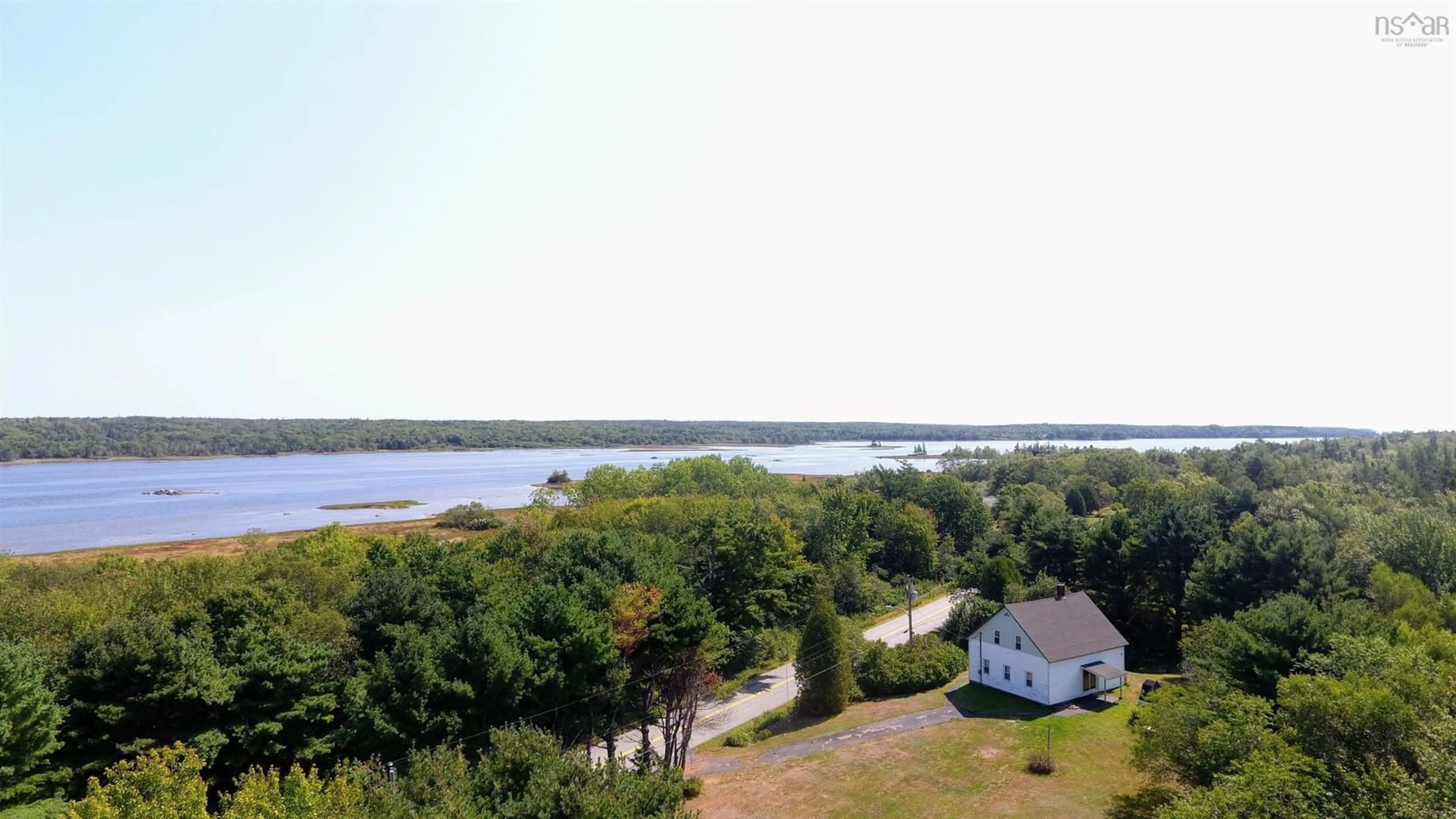 A pic from outside/outdoor area/front of a property/back of a property/a pic from drone, water/lake/river/ocean view for 560 West Sable Rd, West Middle Sable Nova Scotia B0T 1V0