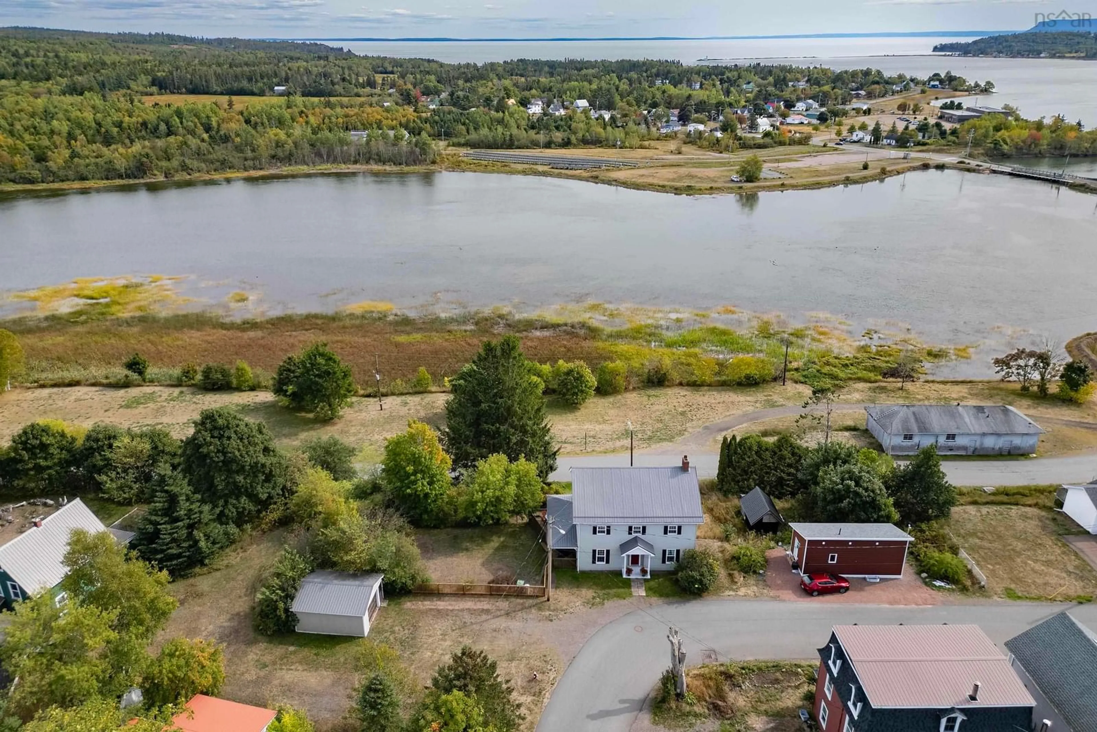 A pic from outside/outdoor area/front of a property/back of a property/a pic from drone, water/lake/river/ocean view for 100 Spring St, Parrsboro Nova Scotia B0M 1S0