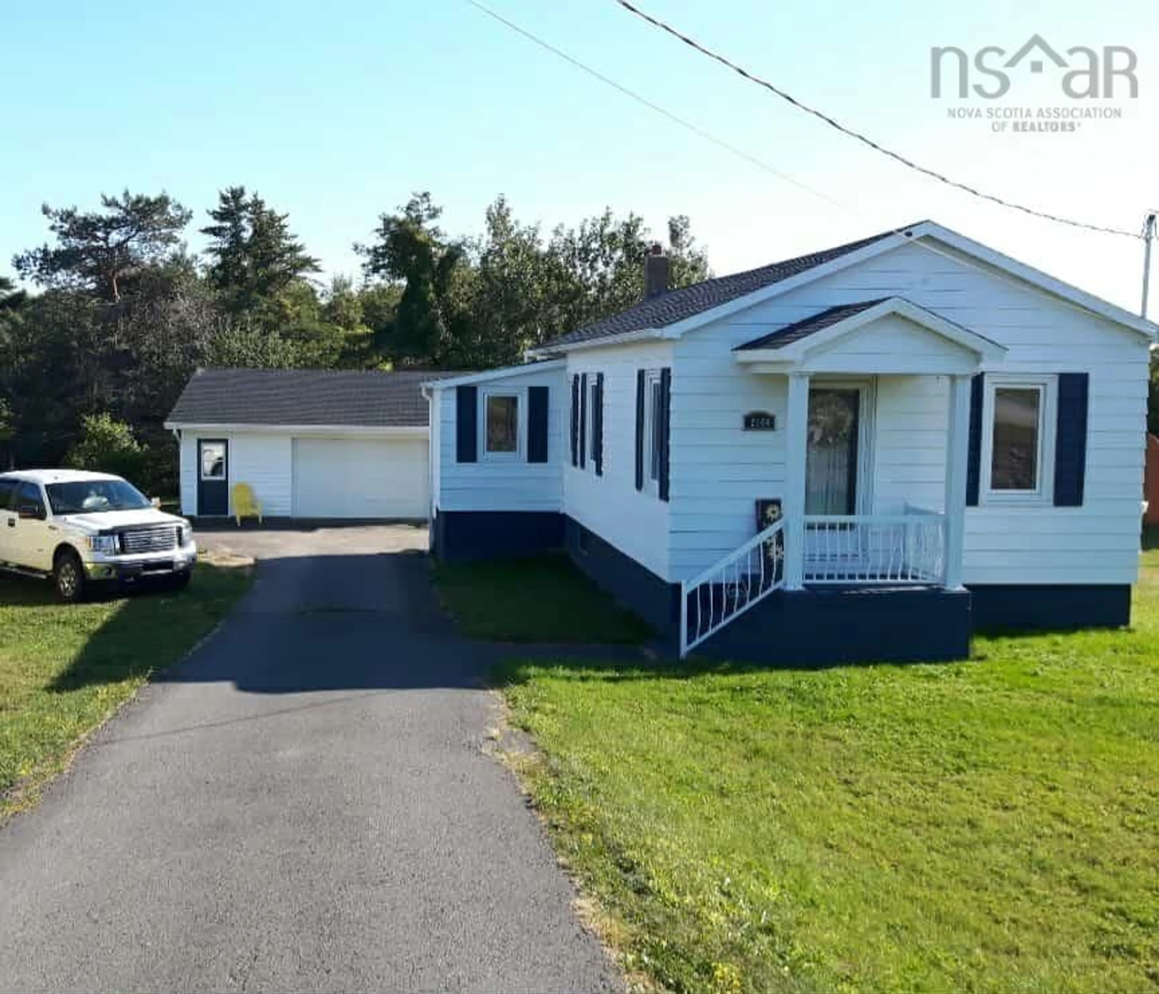 Home with vinyl exterior material, street for 2144 Sydney Rd, Reserve Mines Nova Scotia B1E 1K1