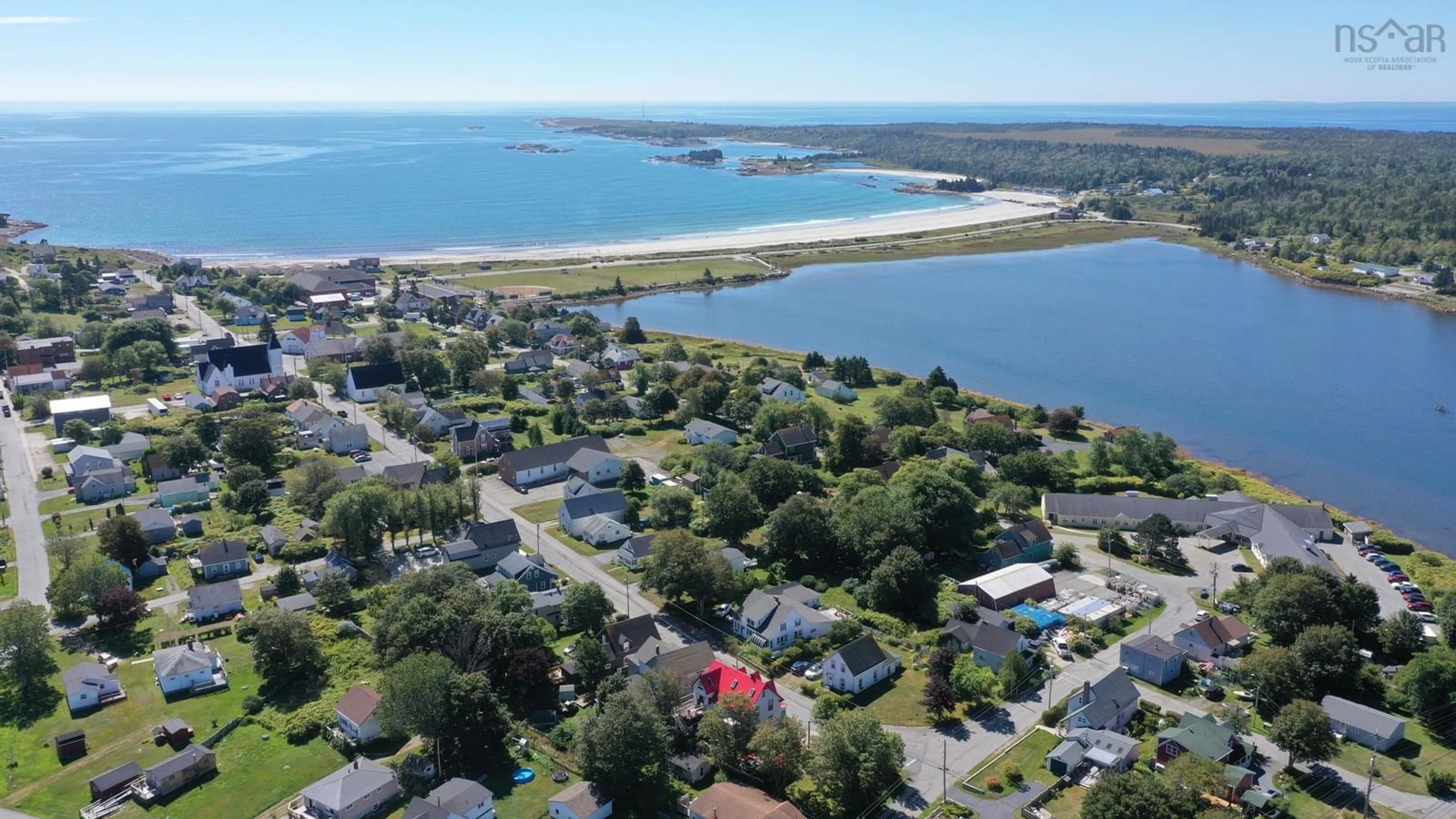 A pic from outside/outdoor area/front of a property/back of a property/a pic from drone, water/lake/river/ocean view for 132 Hall St, Lockeport Nova Scotia B0T 1L0