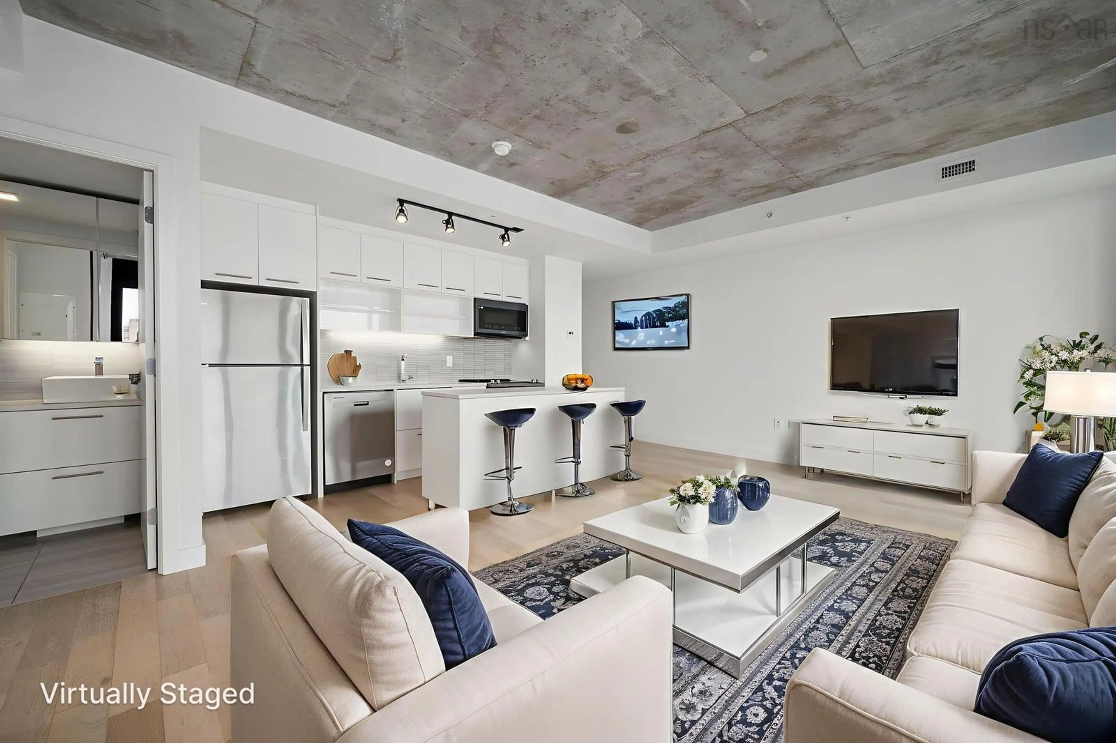 Living room with furniture, cement floor for 1048 Wellington St #614, Halifax Nova Scotia B3H 2Z8