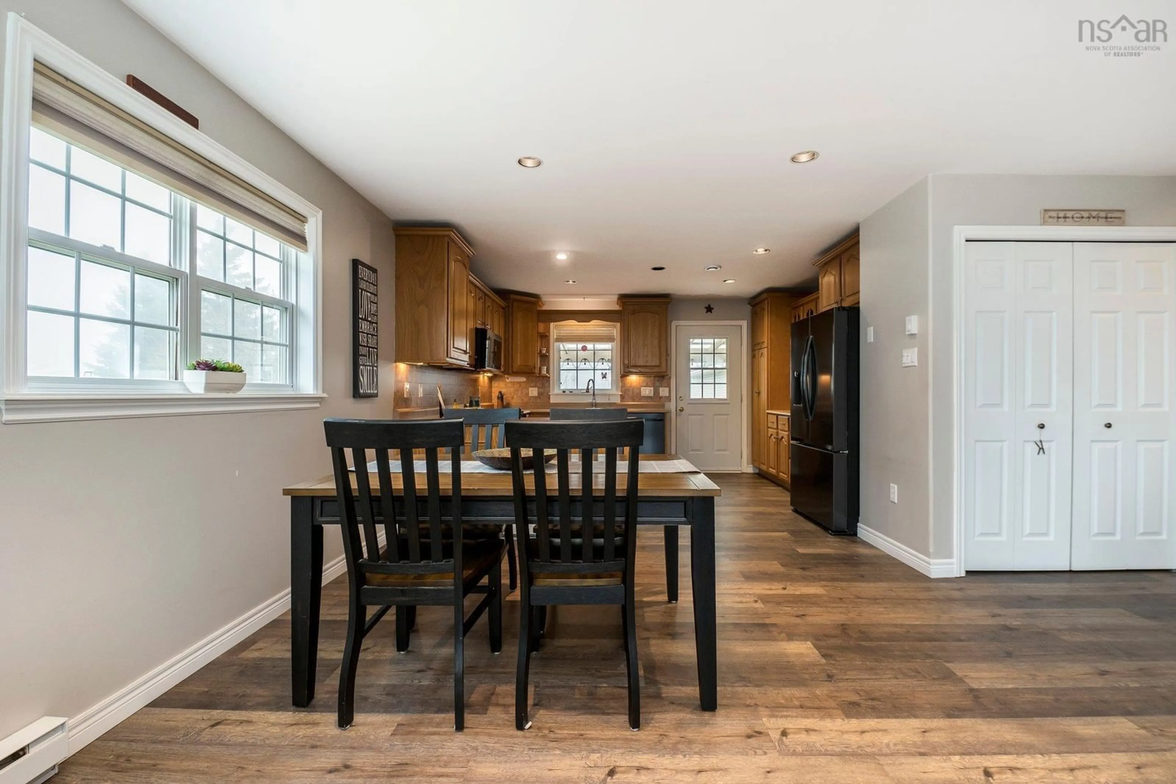 Open concept kitchen, wood/laminate floor for 1918 Caldwell Rd, Eastern Passage Nova Scotia B3G 1J3
