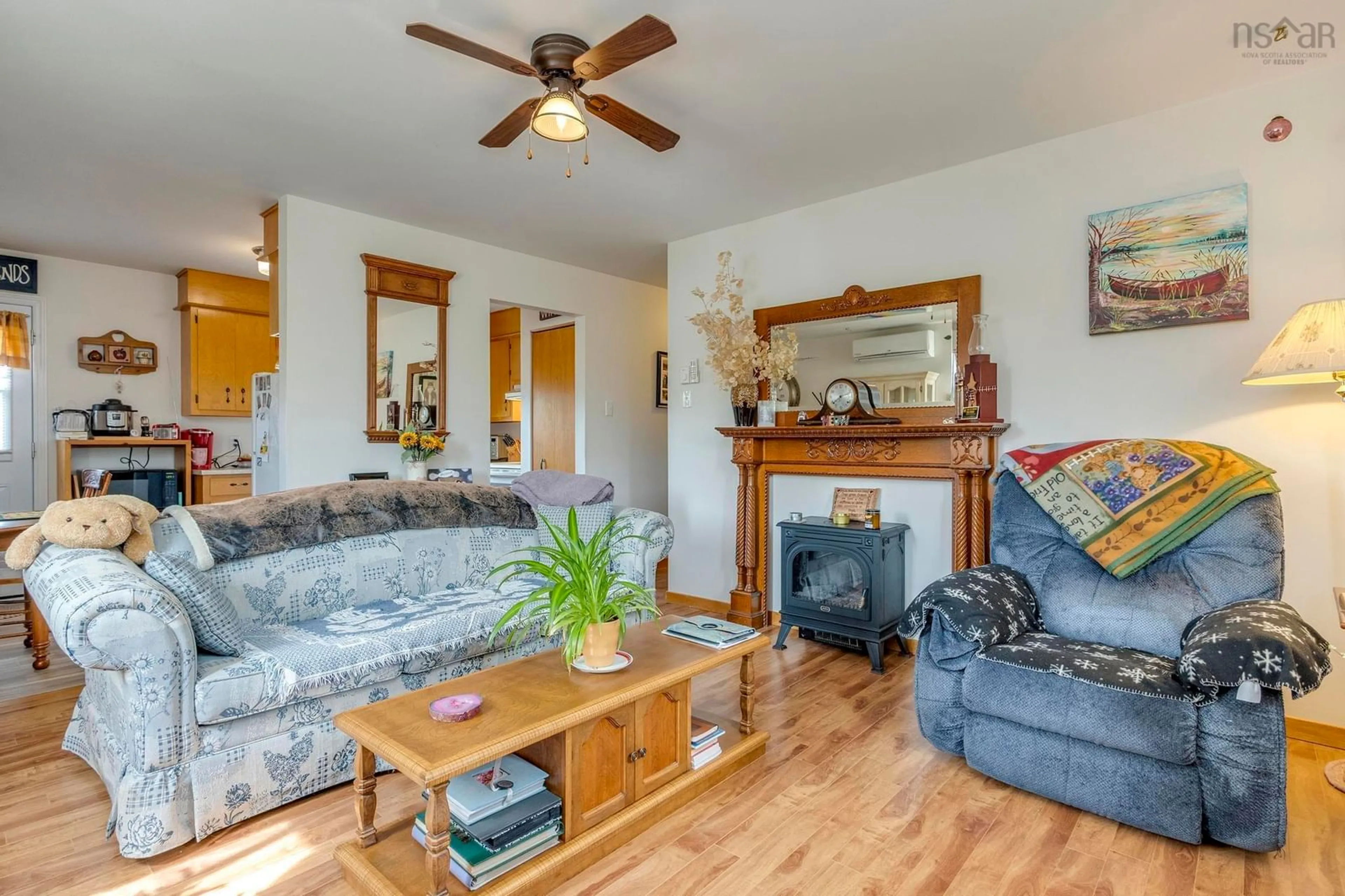 Living room with furniture, wood/laminate floor for 589 Sampson Dr #A&B, Greenwood Nova Scotia B0P 1R0