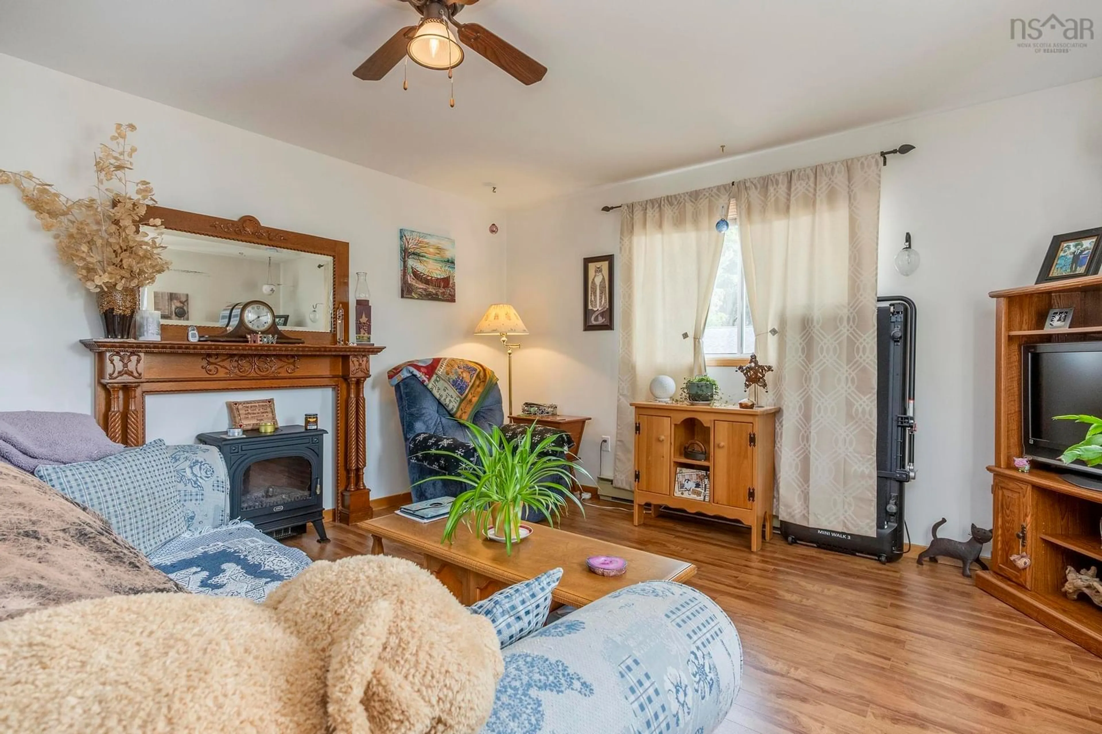 Living room with furniture, wood/laminate floor for 589 Sampson Dr #A&B, Greenwood Nova Scotia B0P 1R0
