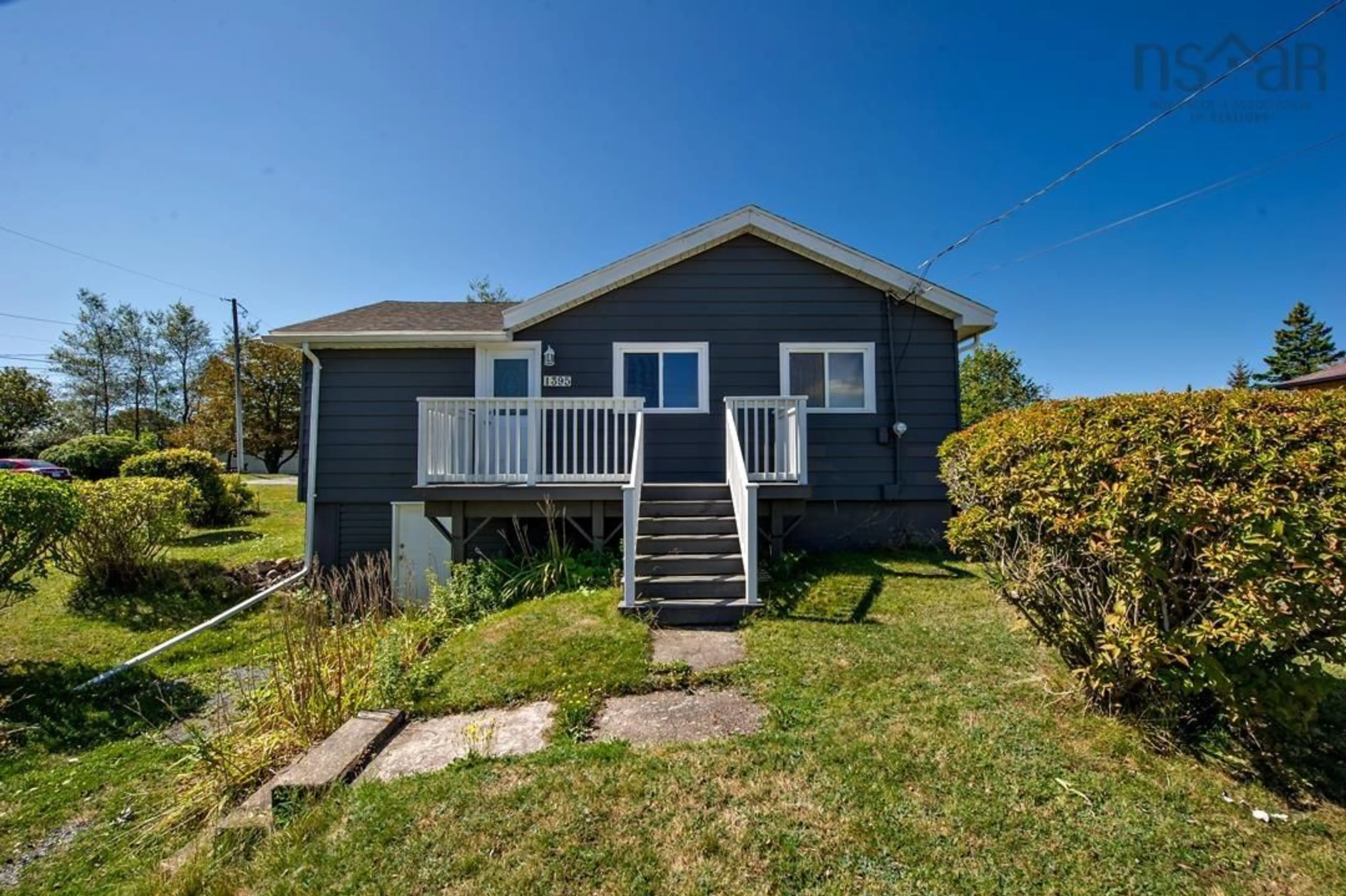 Home with vinyl exterior material, street for 1395 Main Rd, Eastern Passage Nova Scotia B3G 3E9