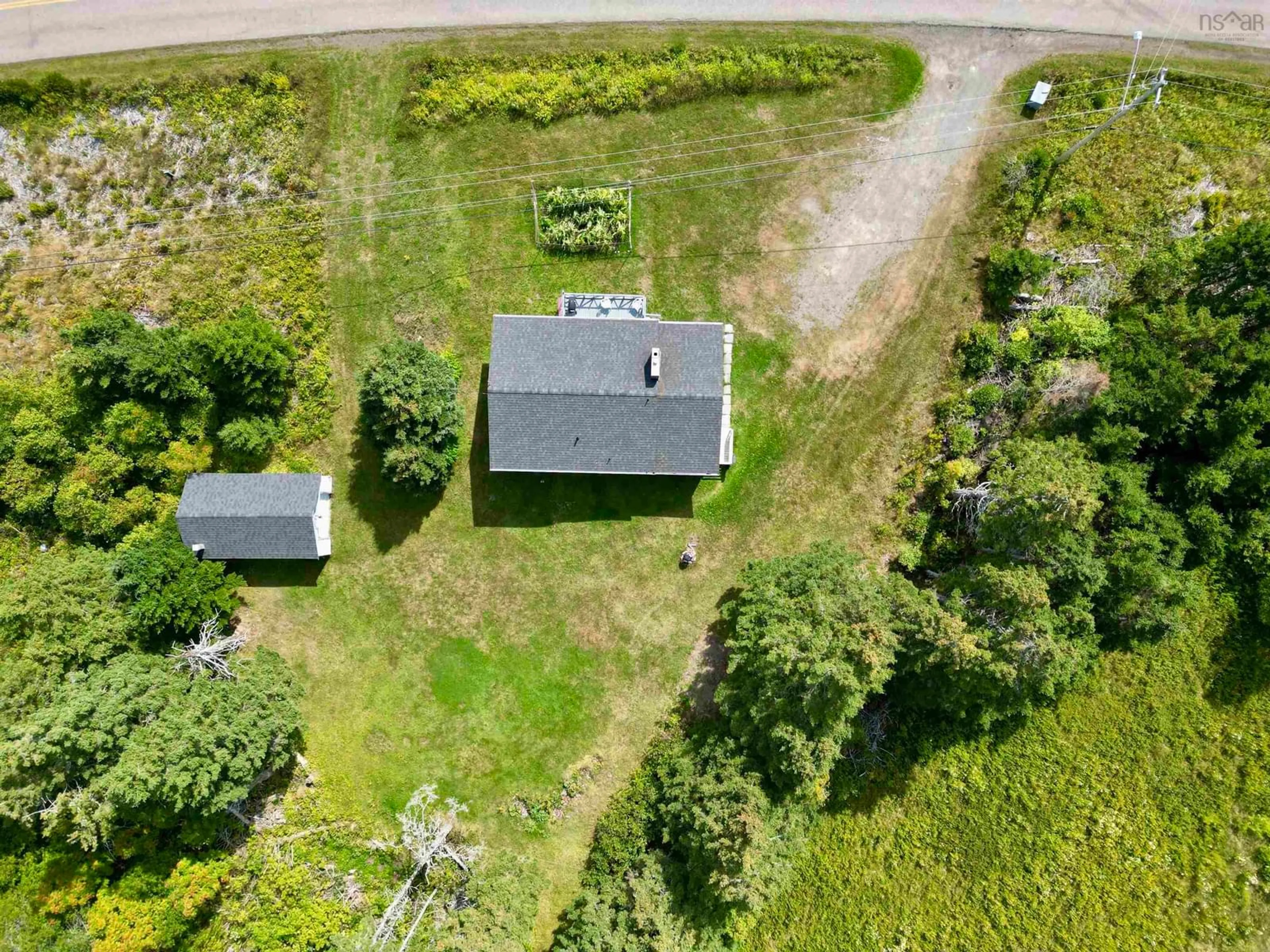 A pic from outside/outdoor area/front of a property/back of a property/a pic from drone, unknown for 171 Rocky Bay Rd., Pondville Nova Scotia B0E 1K0