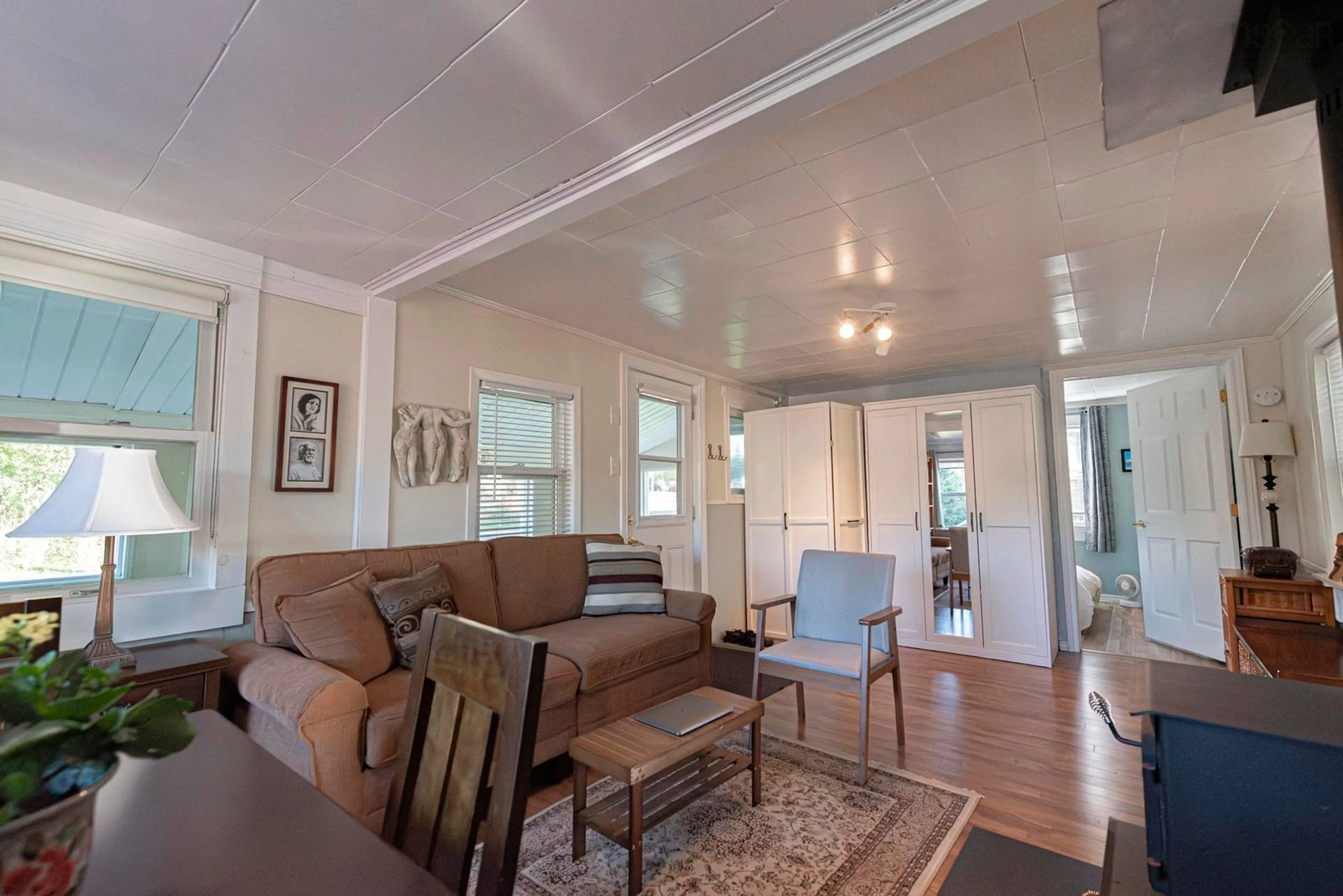 Living room with furniture, wood/laminate floor for 209 Ghana Ave, New Glasgow Nova Scotia B2H 4X2
