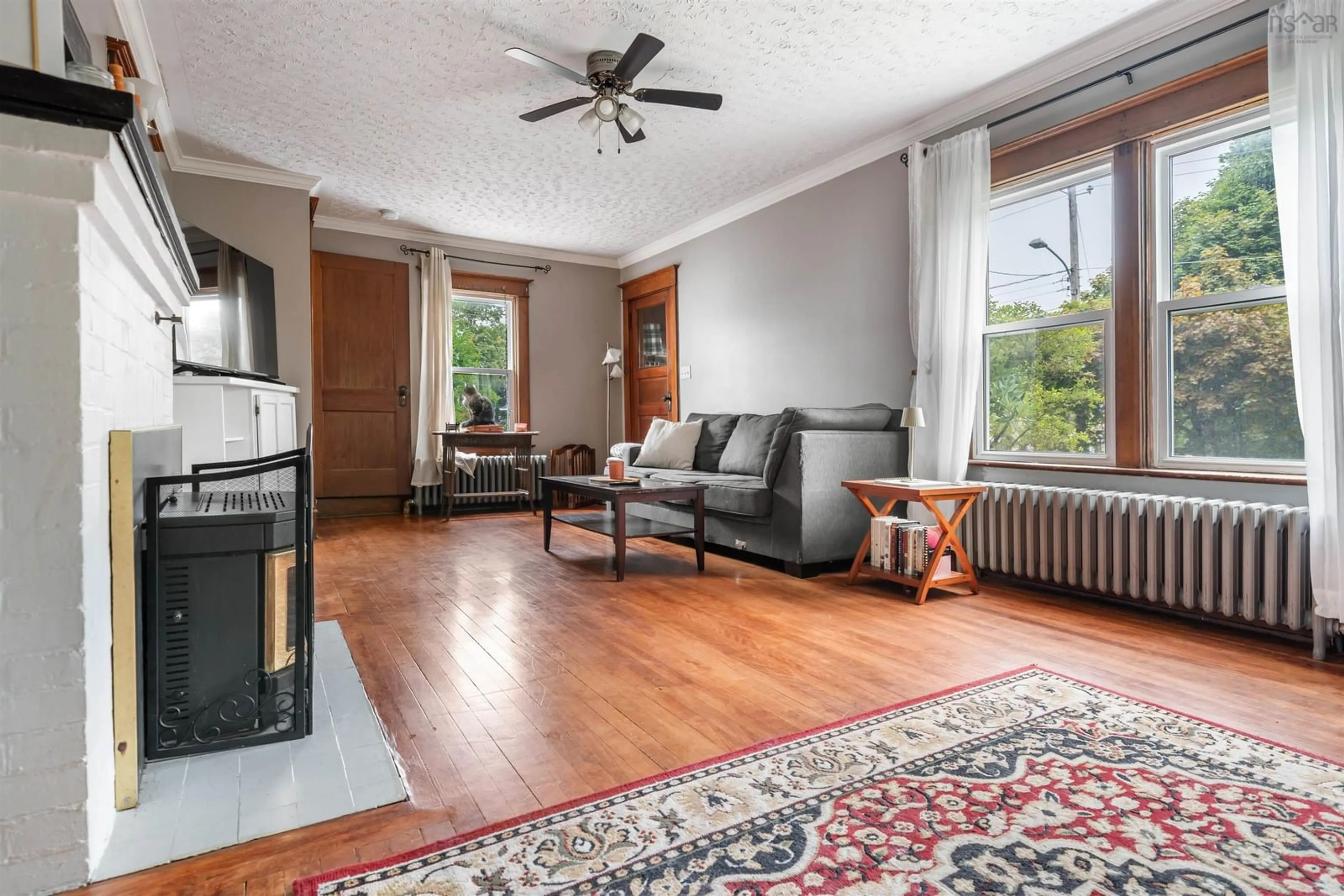Living room with furniture, wood/laminate floor for 28 Mitchell St, New Glasgow Nova Scotia B2H 1H1