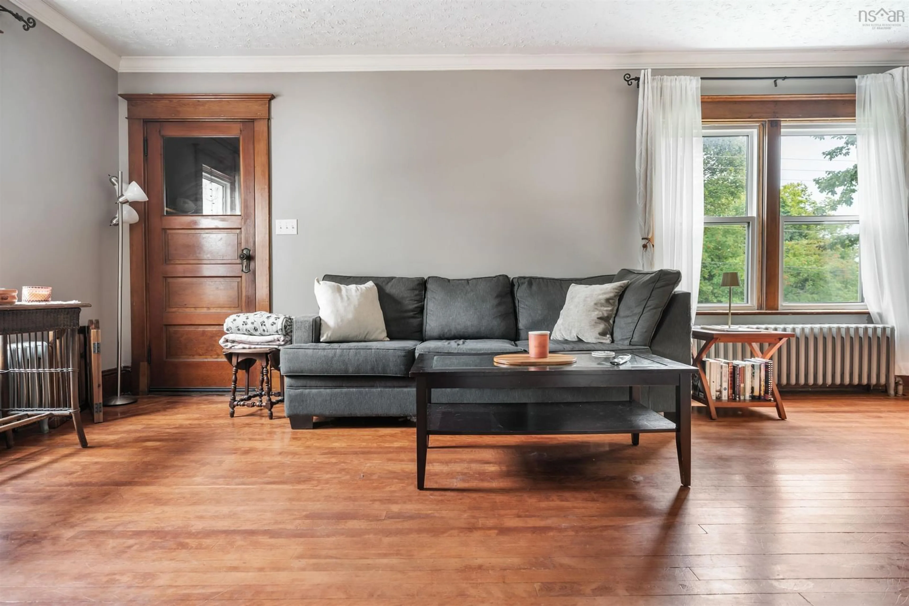 Living room with furniture, wood/laminate floor for 28 Mitchell St, New Glasgow Nova Scotia B2H 1H1