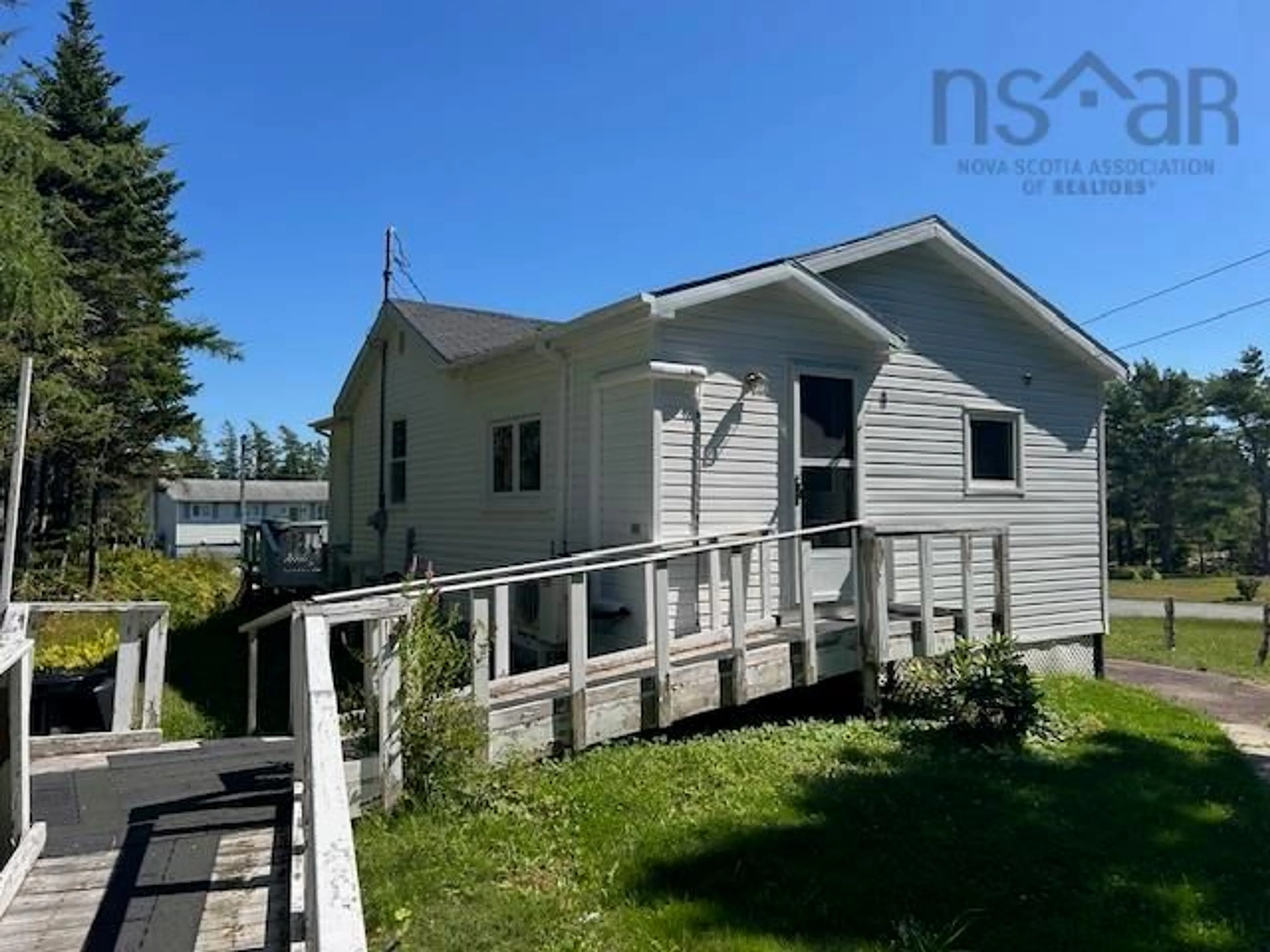 A pic from outside/outdoor area/front of a property/back of a property/a pic from drone, water/lake/river/ocean view for 59 De Raymond St, St. Peter's Nova Scotia B0E 3B0
