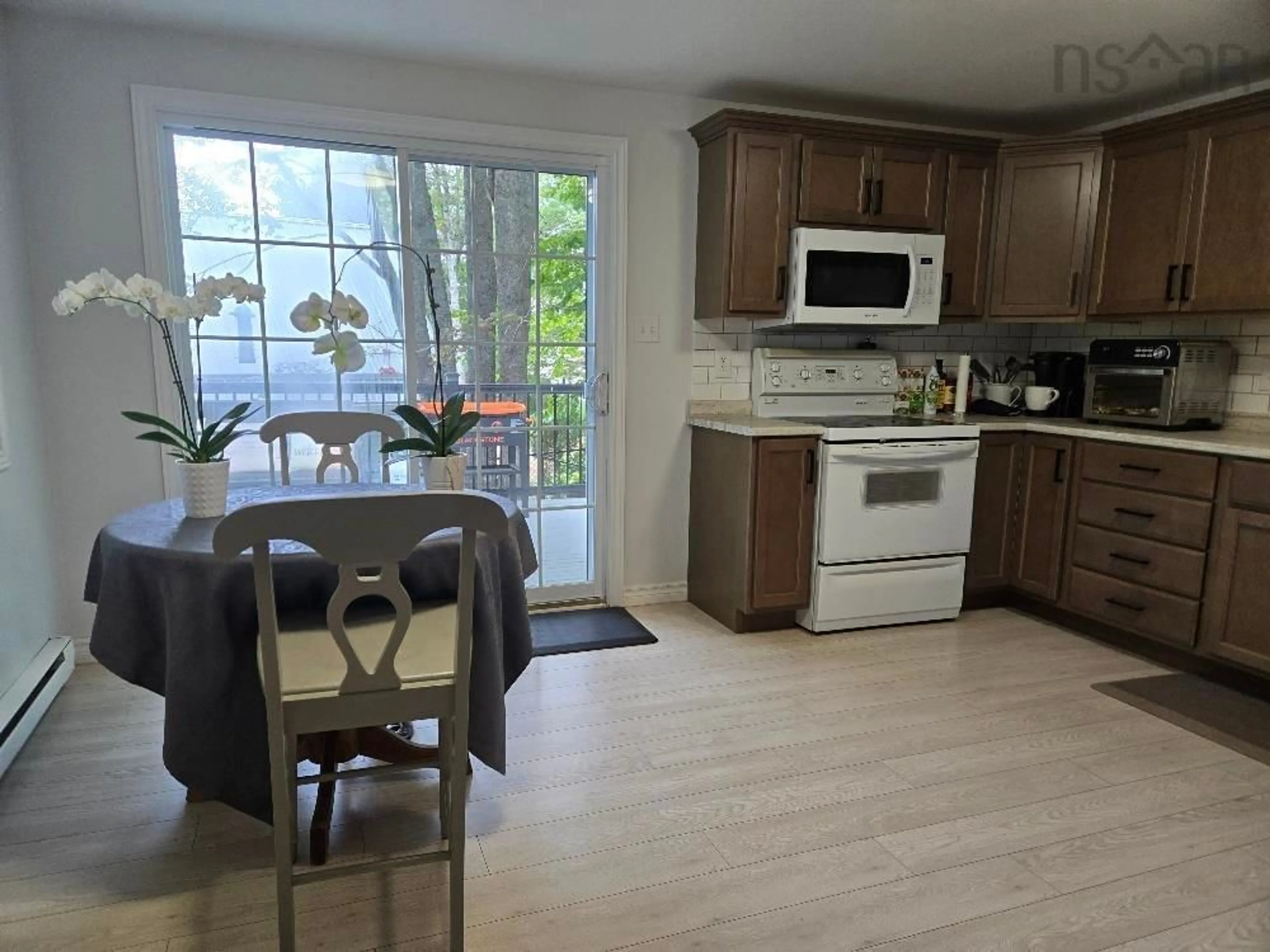 Open concept kitchen, wood/laminate floor for 21 Heritage Place, Truro Nova Scotia B2N 6J4