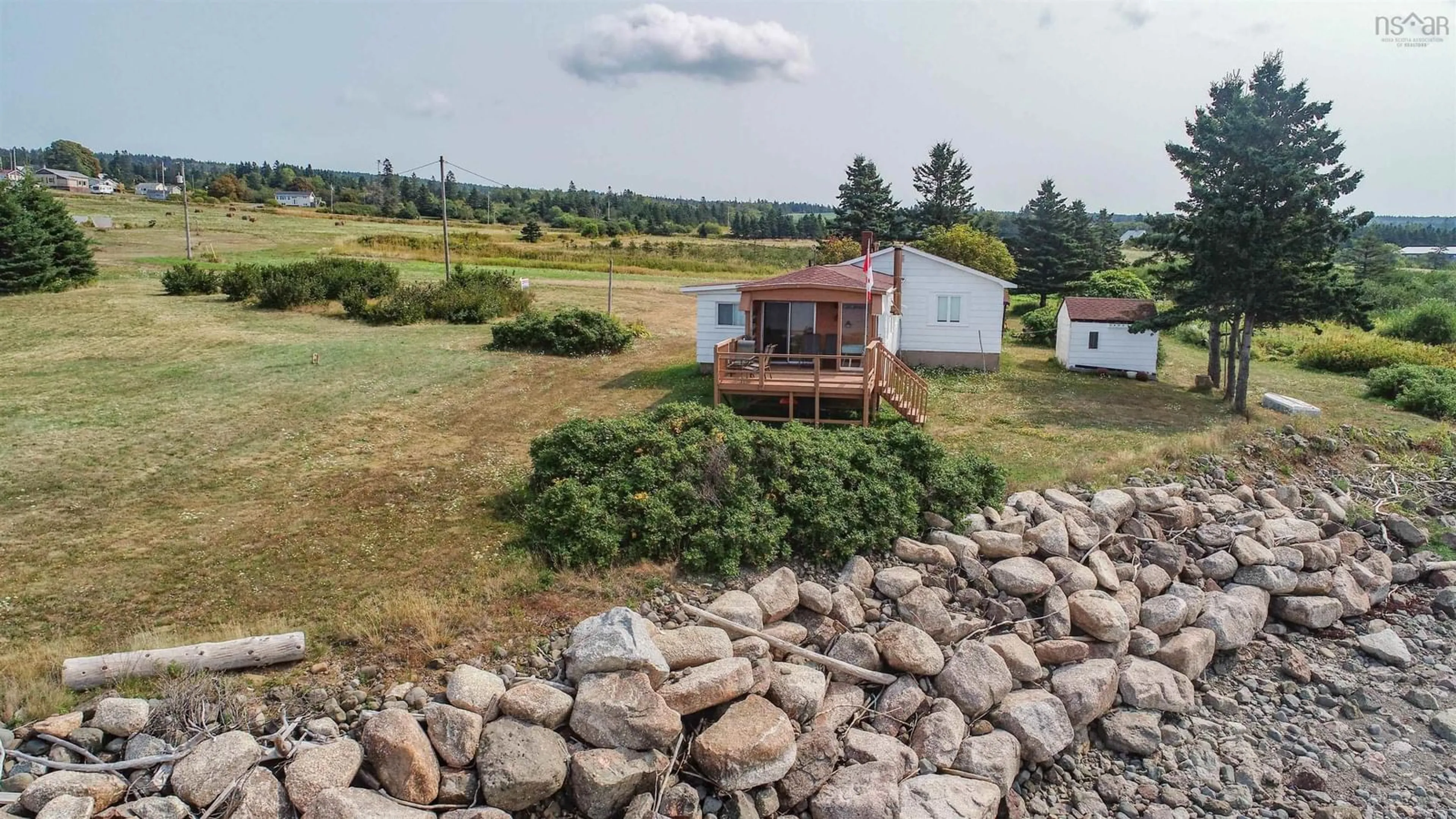 A pic from outside/outdoor area/front of a property/back of a property/a pic from drone, water/lake/river/ocean view for 1472 Cape Split Rd, Scots Bay Nova Scotia B0P 1H0