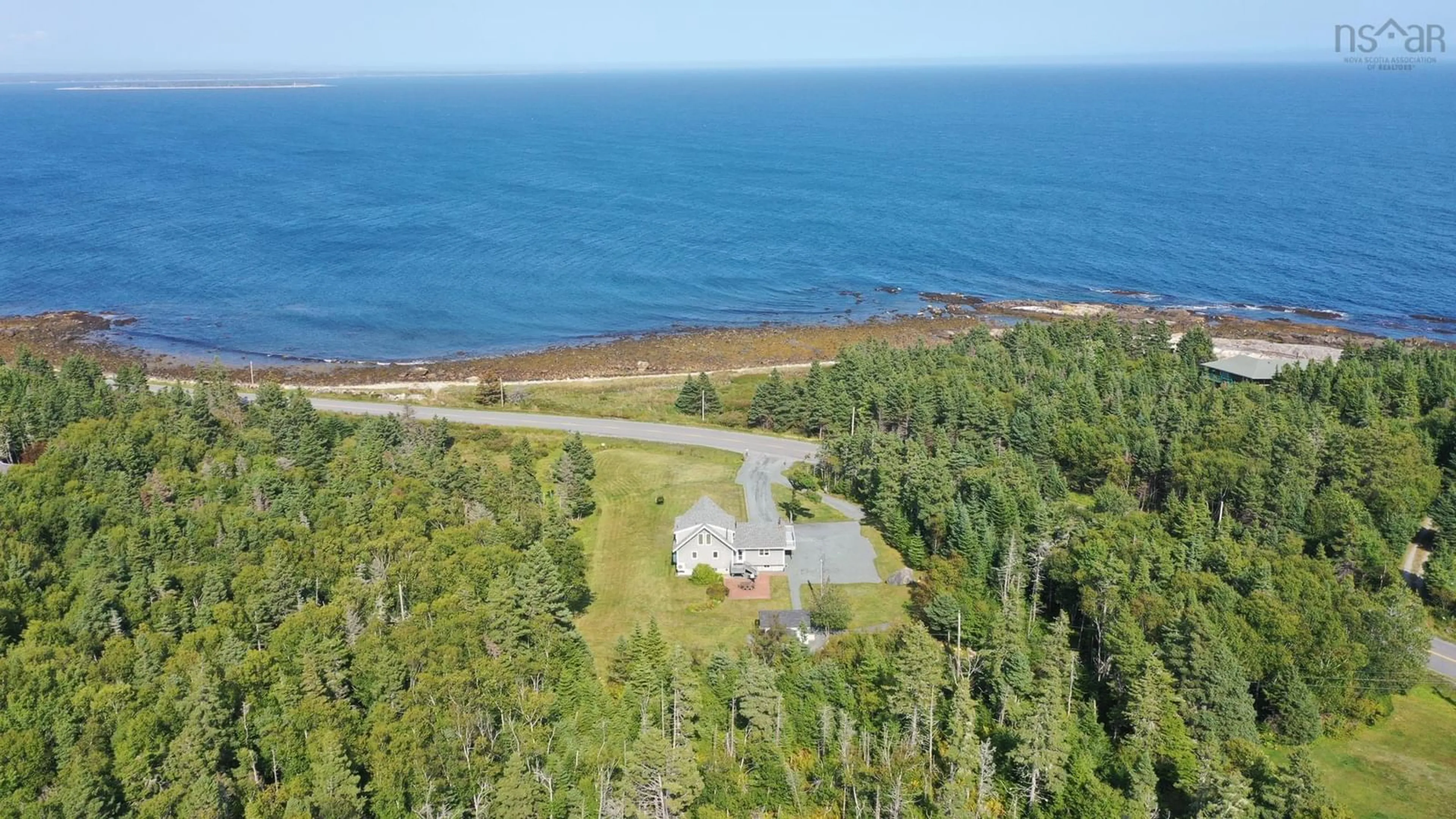 A pic from outside/outdoor area/front of a property/back of a property/a pic from drone, water/lake/river/ocean view for 1228 Rr1 Shore Rd, Western Head Nova Scotia B0T 1K0